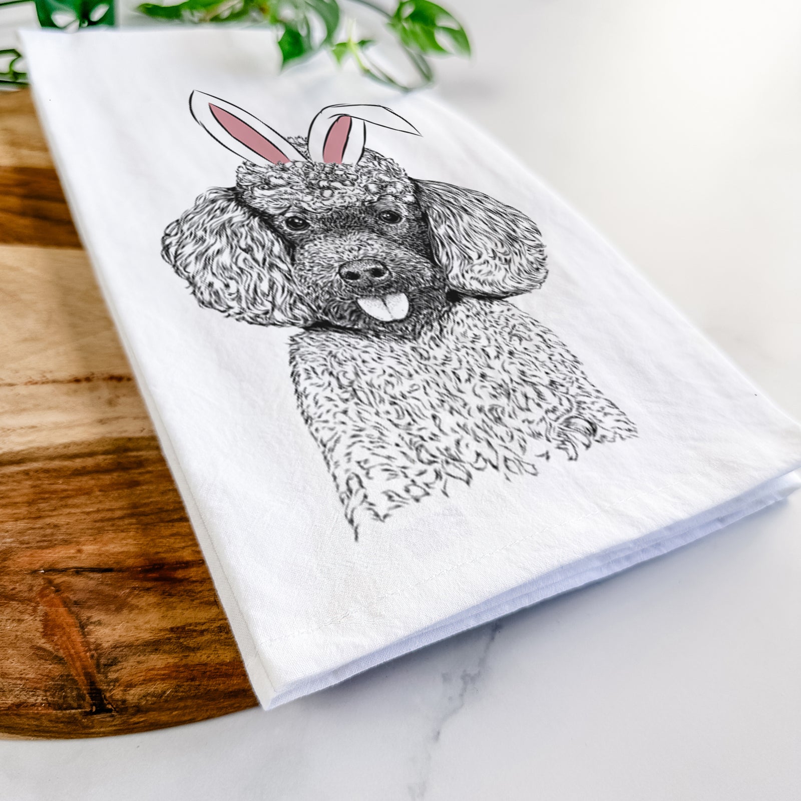 Hand-drawn sketch of George the Toy Poodle wearing Easter bunny ears on a tea towel