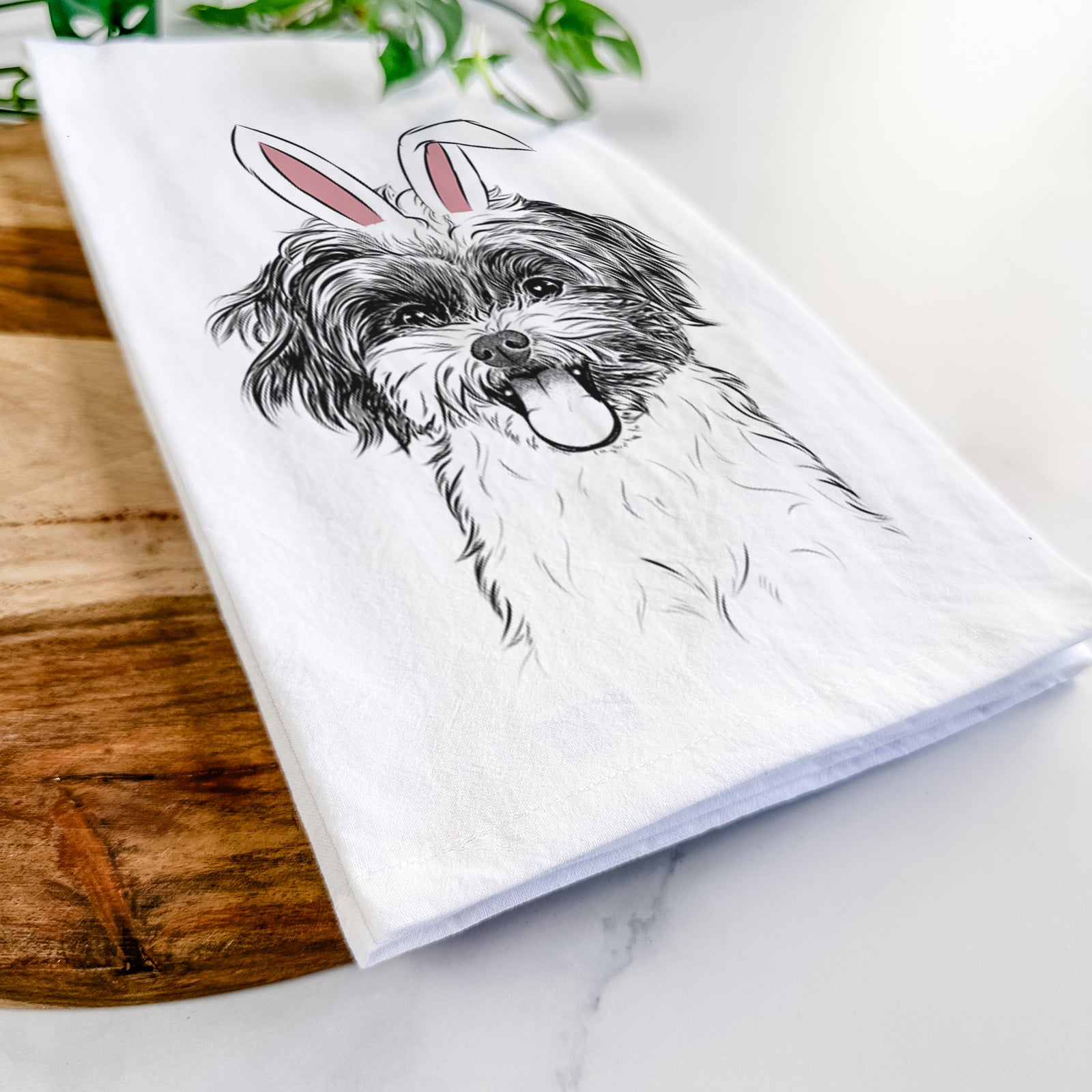 Hand-drawn sketch of Pepper the Shihpoo wearing Easter bunny ears on a tea towel
