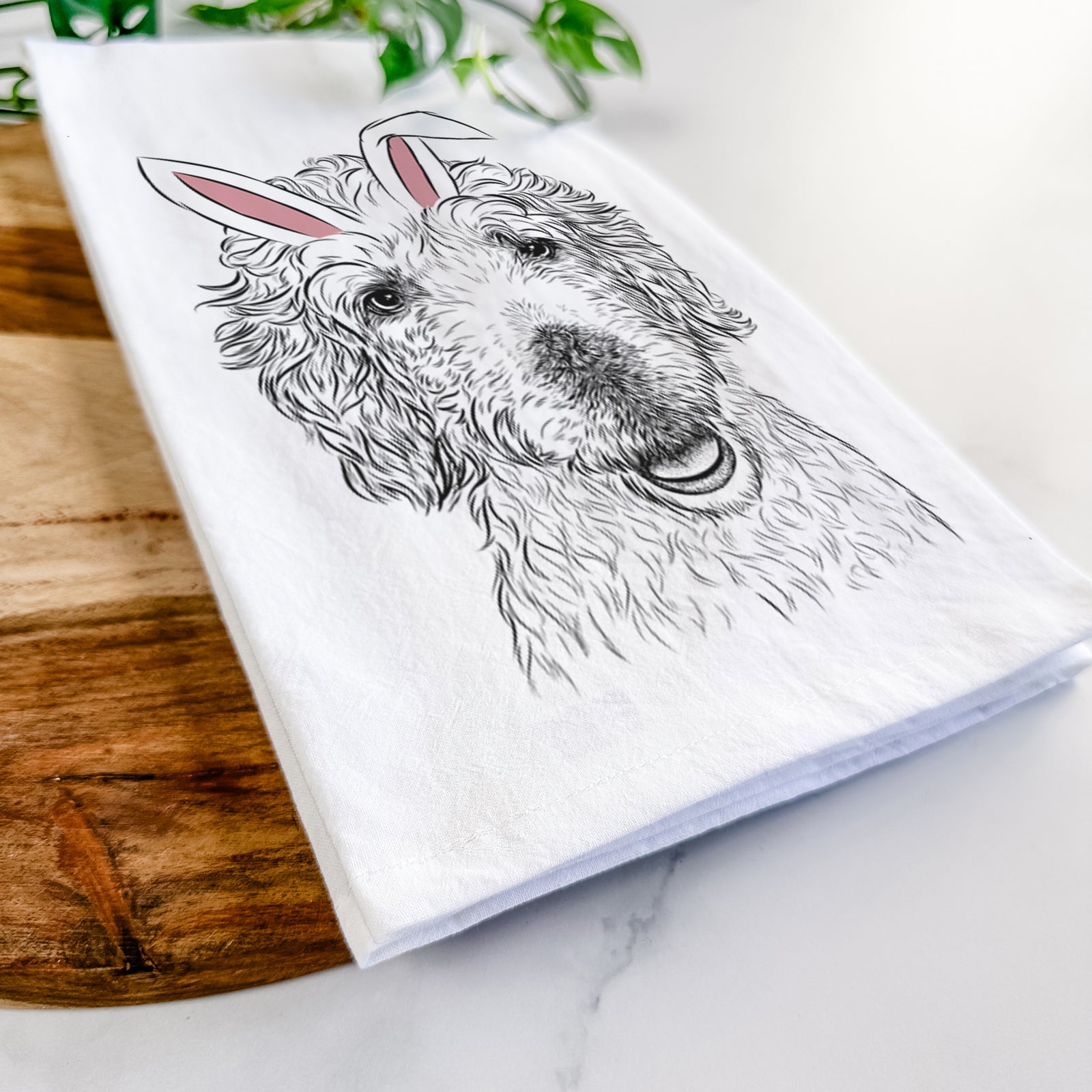 Hand-drawn sketch of Preston the Labradoodle wearing Easter bunny ears on a tea towel