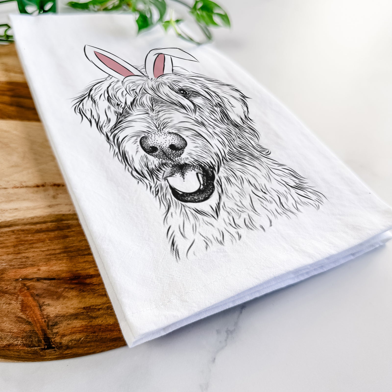 Hand-drawn sketch of Ragnar the Irish Wolfhound wearing Easter bunny ears on a tea towel