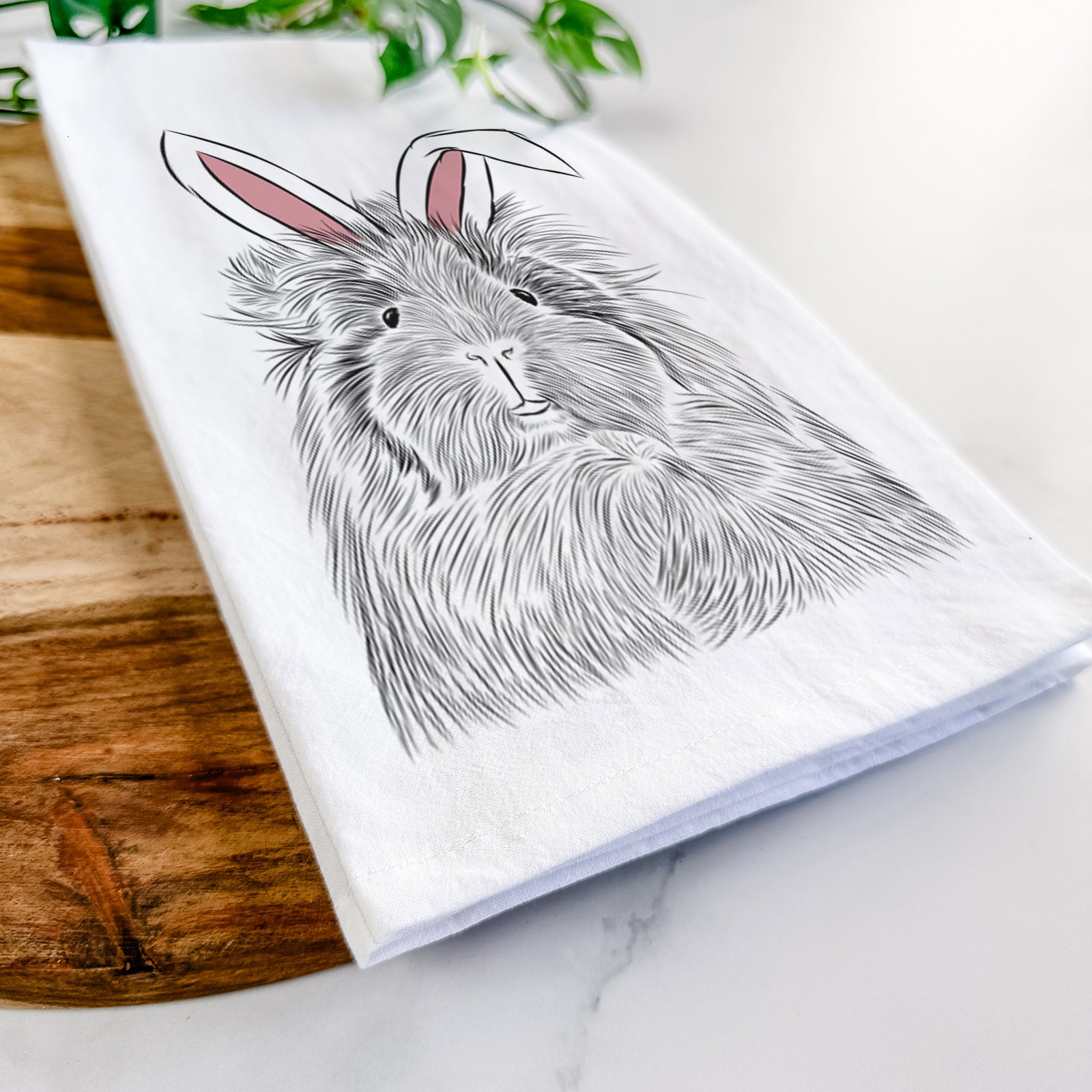 Hand-drawn sketch of Rhino the Guinea Pig wearing Easter bunny ears on a tea towel