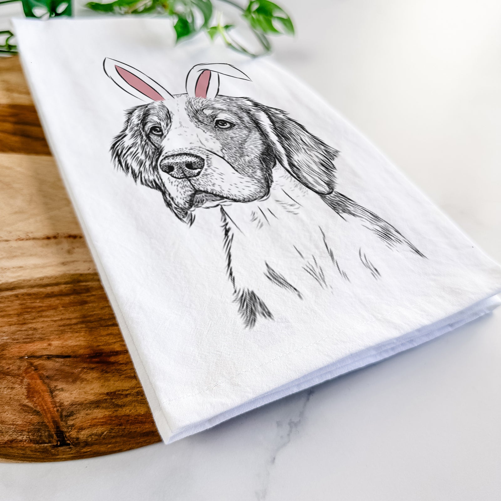 Hand-drawn sketch of Roxy the Welsh Springer Spaniel wearing Easter bunny ears on a tea towel