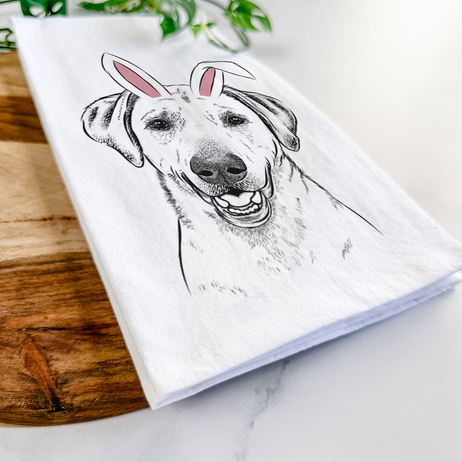 Hand-drawn sketch of Rusty the Labrador Retriever wearing Easter bunny ears on a tea towel