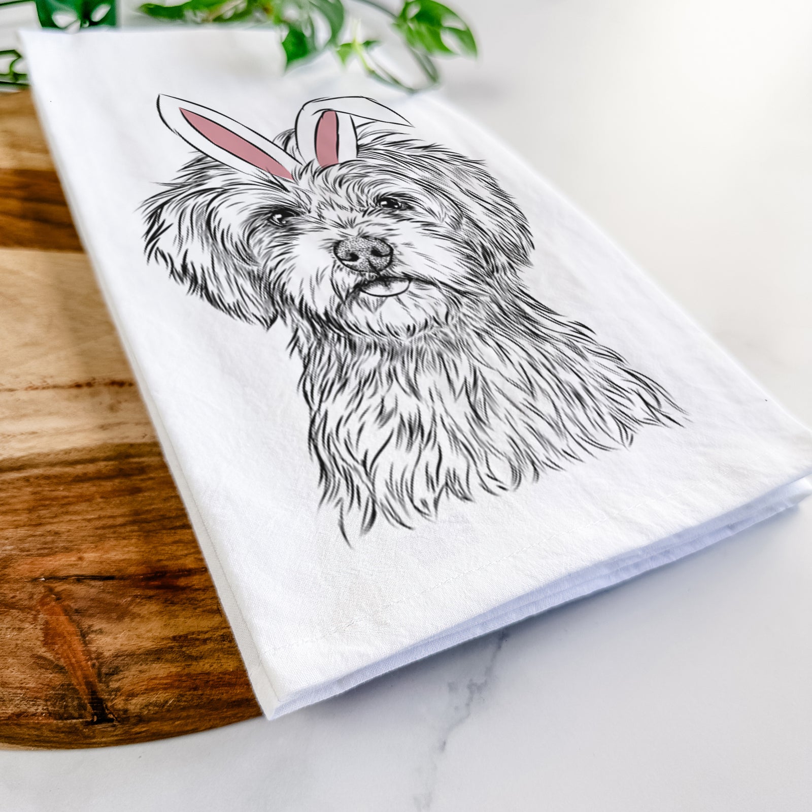 Hand-drawn sketch of Sammy the Shorkie wearing Easter bunny ears on a tea towel