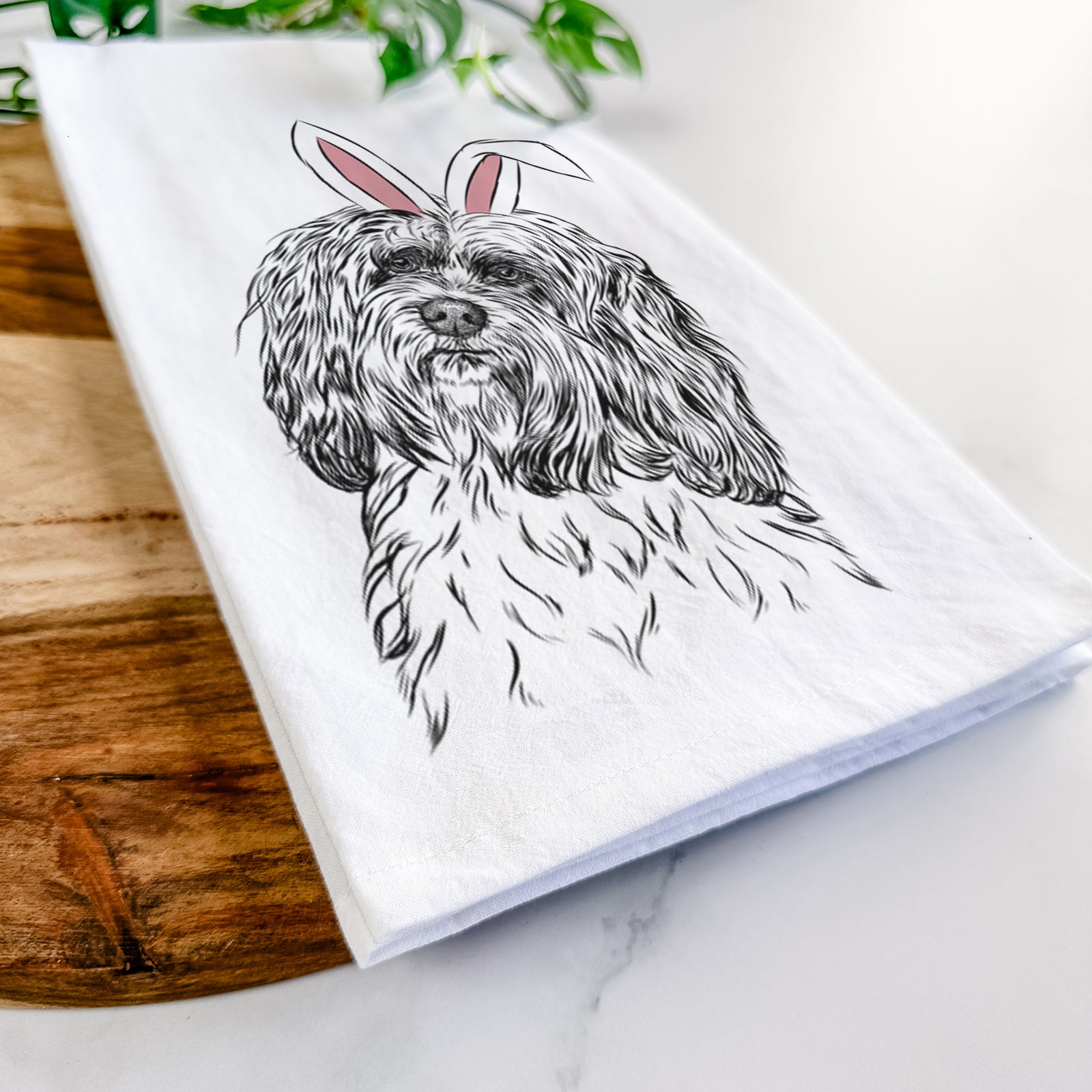 Hand-drawn sketch of Shenpa the Tibetan Terrier wearing Easter bunny ears on a tea towel