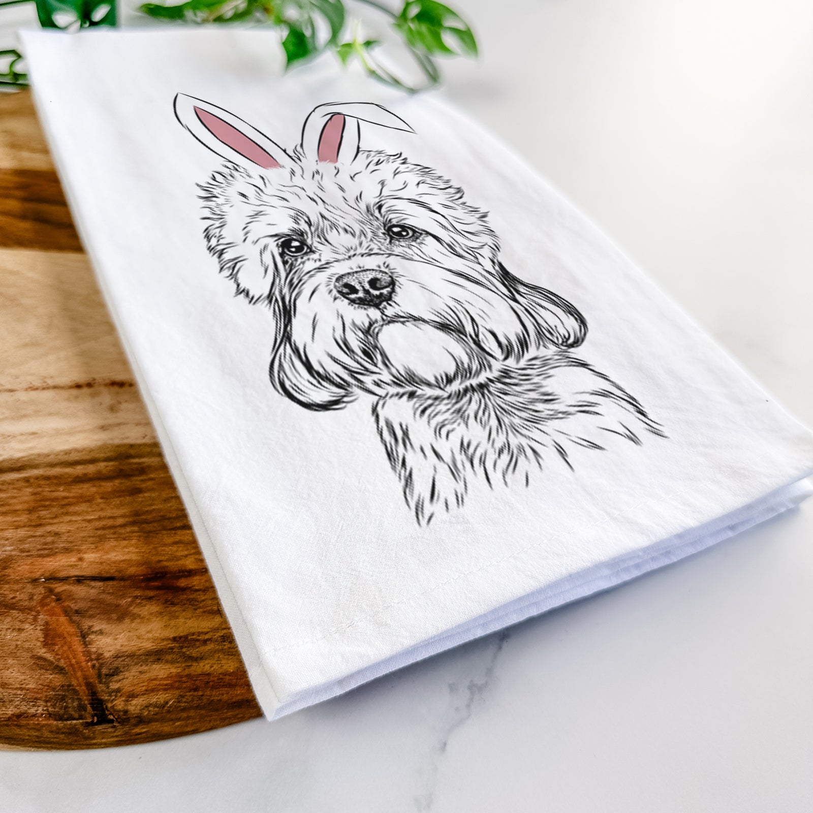 Hand-drawn sketch of Sir Walter the Dandie Dinmont Terrier wearing Easter bunny ears on a tea towel