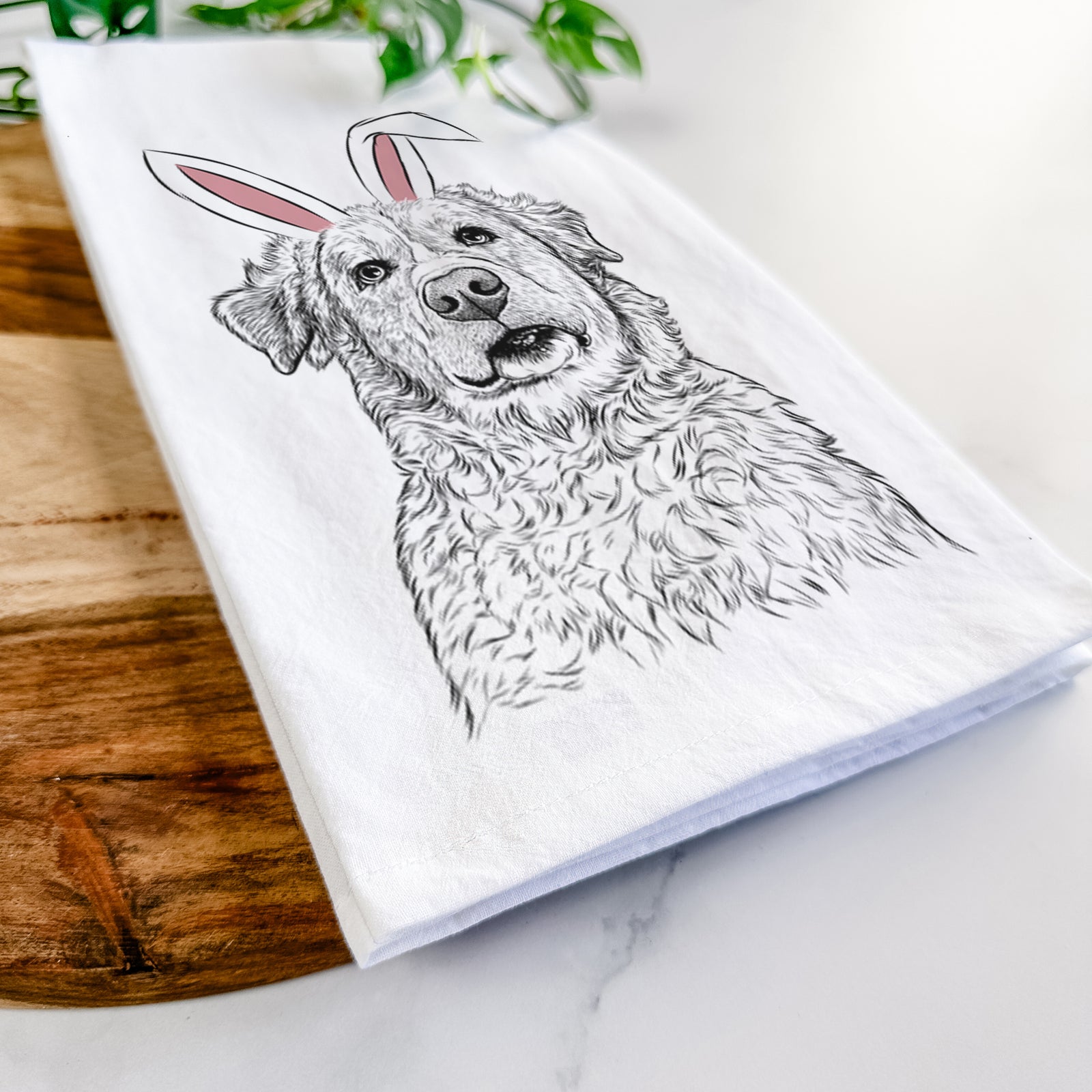 Hand-drawn sketch of Smokey Jam the Middle Eastern Village Dog wearing Easter bunny ears on a tea towel