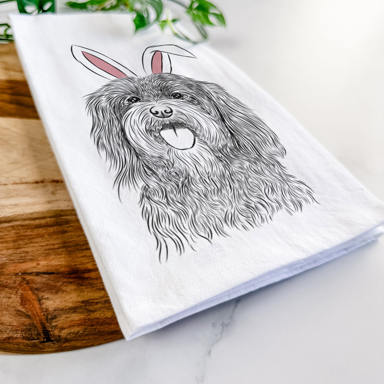 Hand-drawn sketch of Sophie the Havanese wearing Easter bunny ears on a tea towel