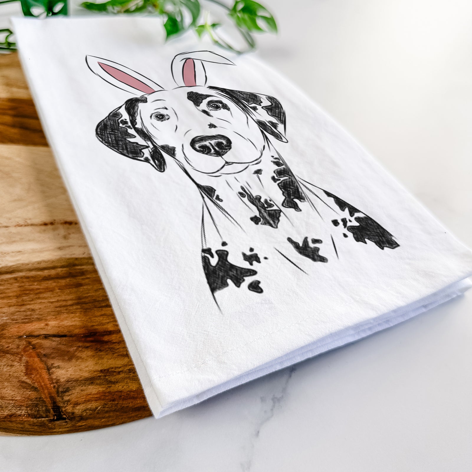 Hand-drawn sketch of Spot the Dalmatian wearing Easter bunny ears on a tea towel