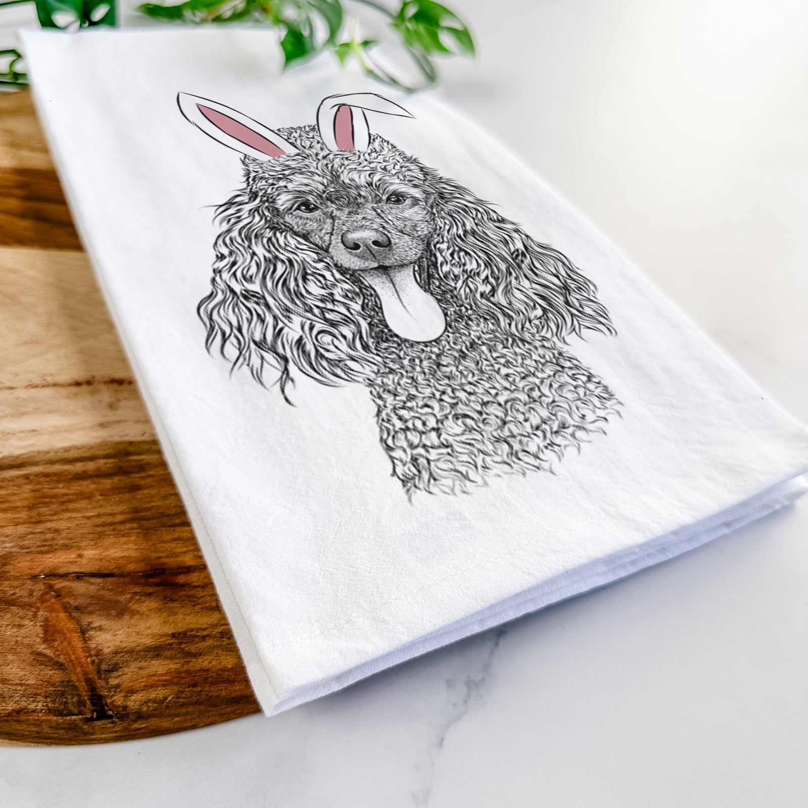 Hand-drawn sketch of Teddy the Mini Poodle wearing Easter bunny ears on a tea towel