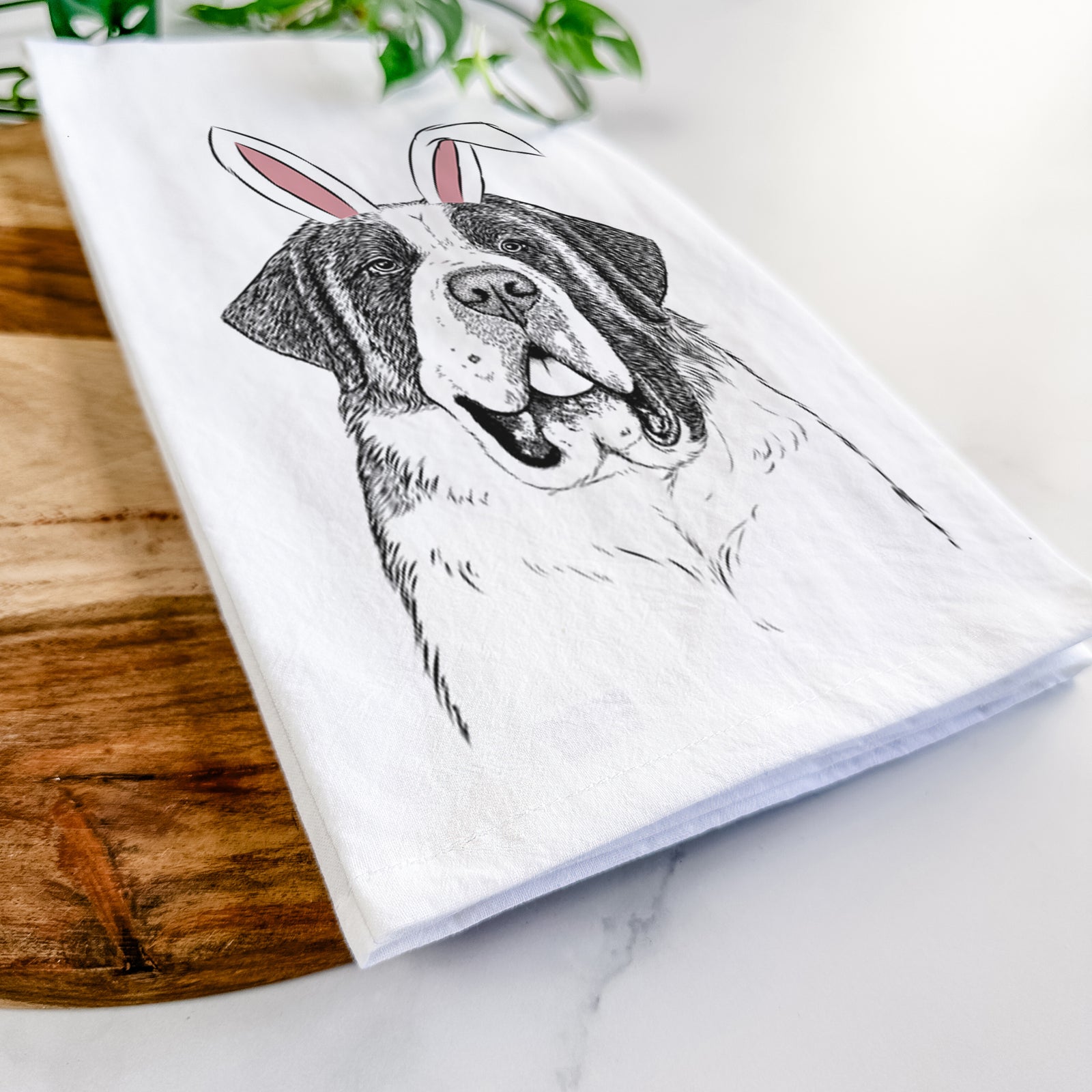 Hand-drawn sketch of Thor the Saint Bernard wearing Easter bunny ears on a tea towel
