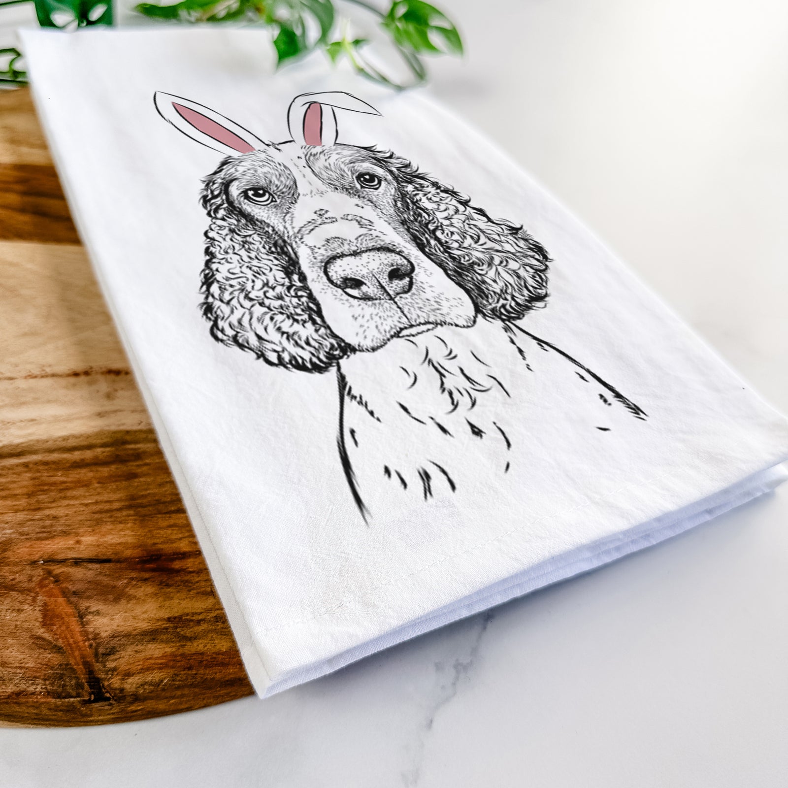 Hand-drawn sketch of Wilbur the English Springer Spaniel wearing Easter bunny ears on a tea towel