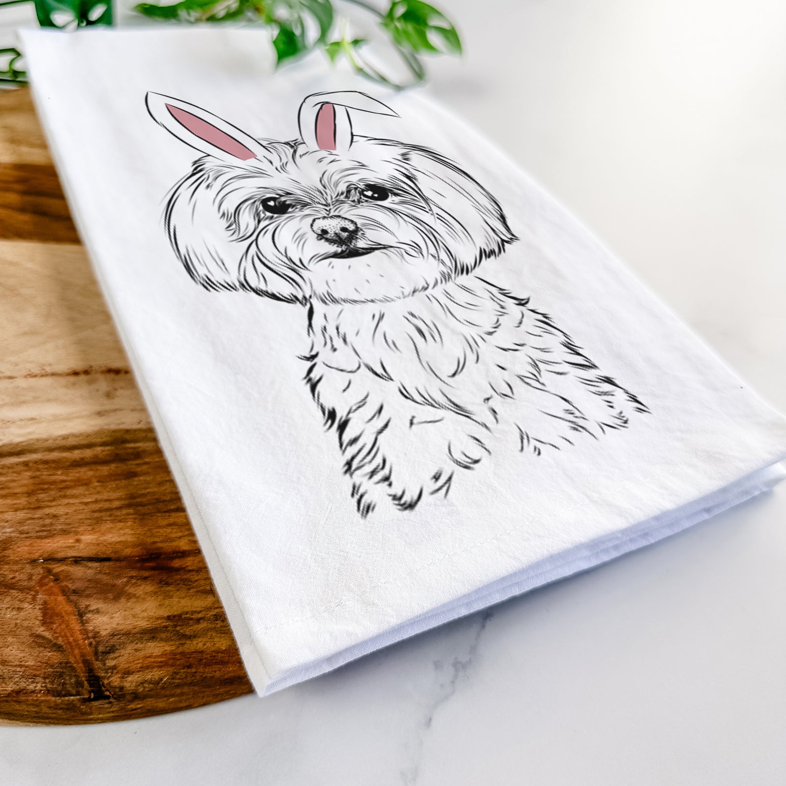 Hand-drawn sketch of Willow the Maltese wearing Easter bunny ears on a tea towel
