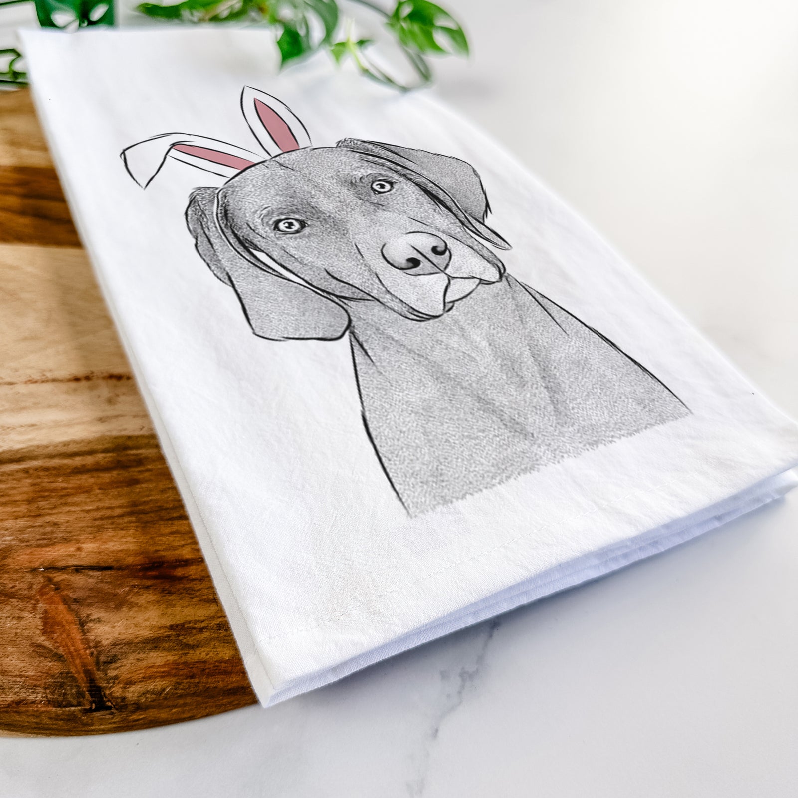 Hand-drawn sketch of Willow the Weizsla wearing Easter bunny ears on a tea towel