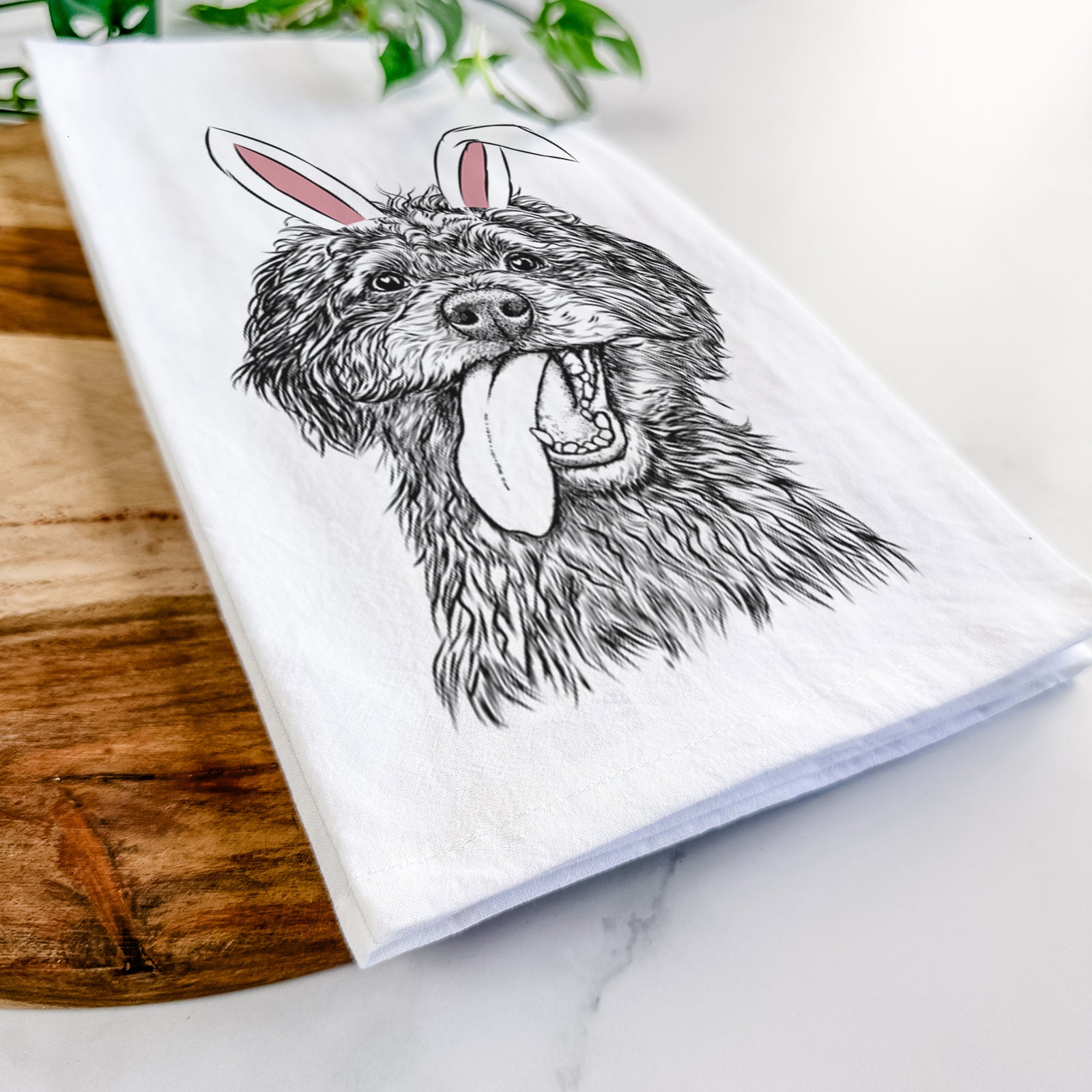 Hand-drawn sketch of Winnie the Mini Aussiedoodle wearing Easter bunny ears on a tea towel