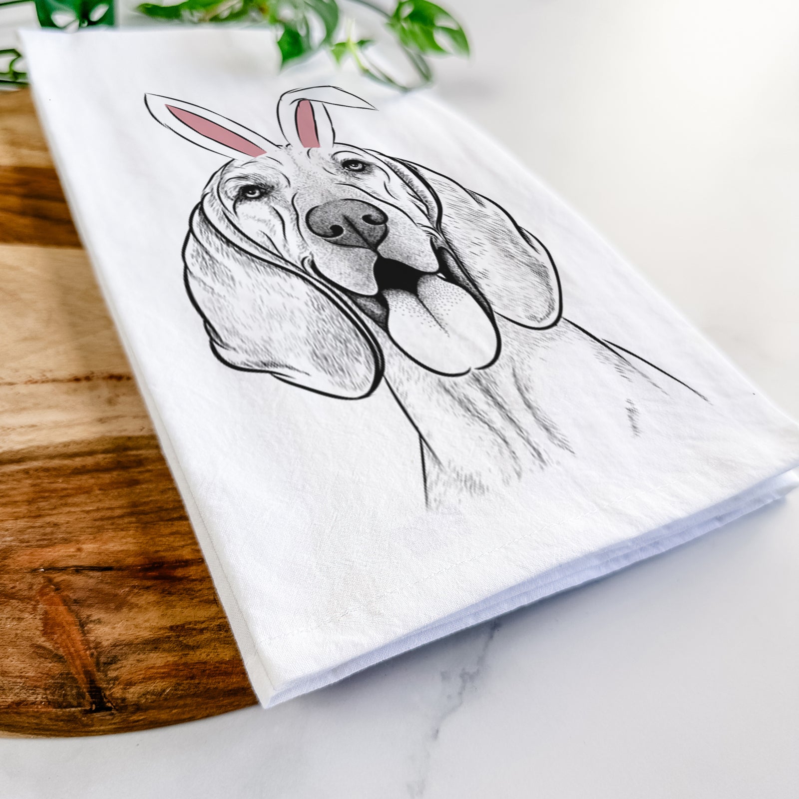 Hand-drawn sketch of Winston the Redbone Coonhound wearing Easter bunny ears on a tea towel