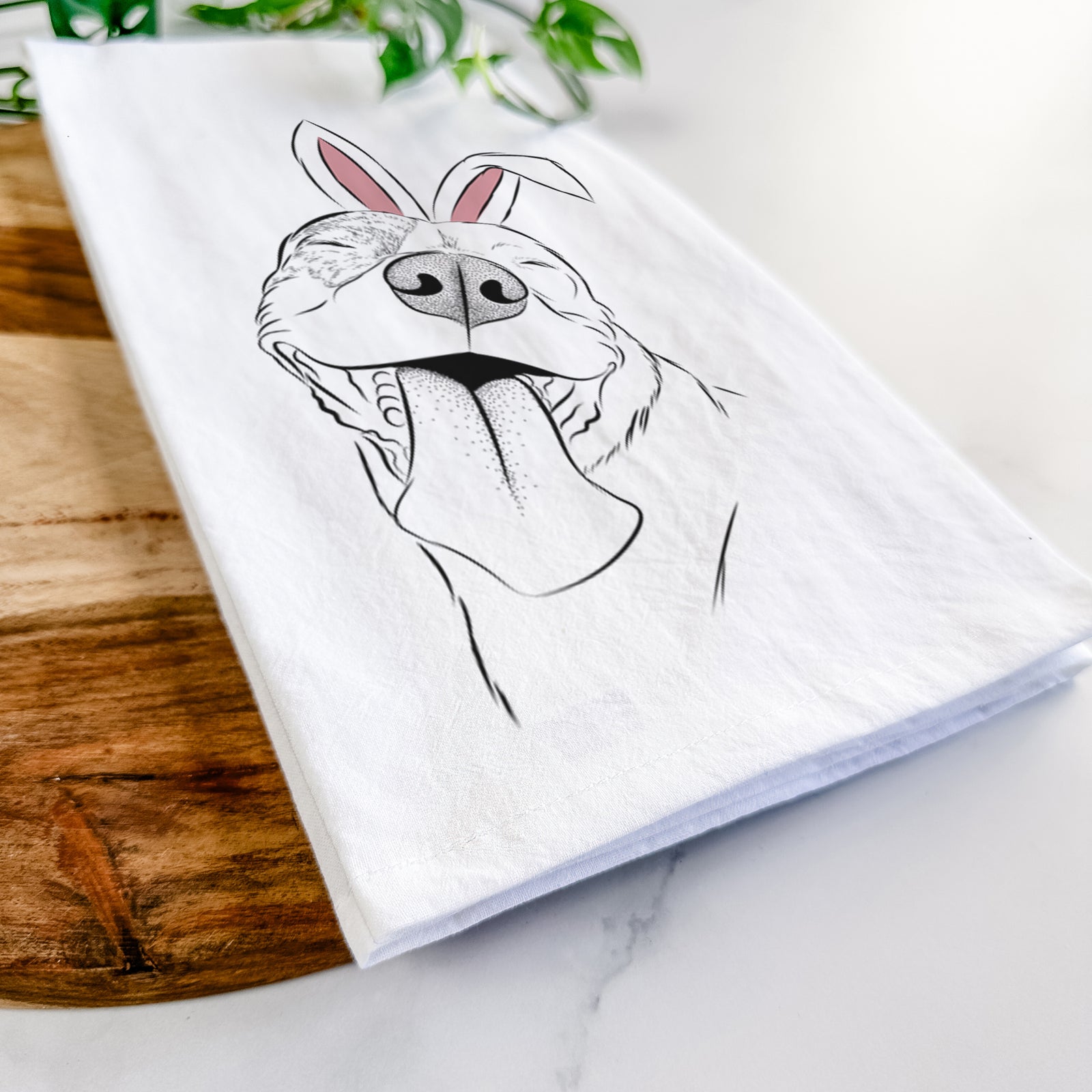 Hand-drawn sketch of Xena the American Staffordshire Terrier wearing Easter bunny ears on a tea towel