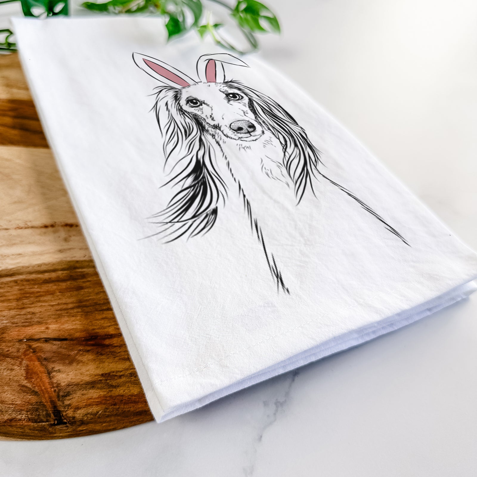 Hand-drawn sketch of Zahra the Saluki wearing Easter bunny ears on a tea towel