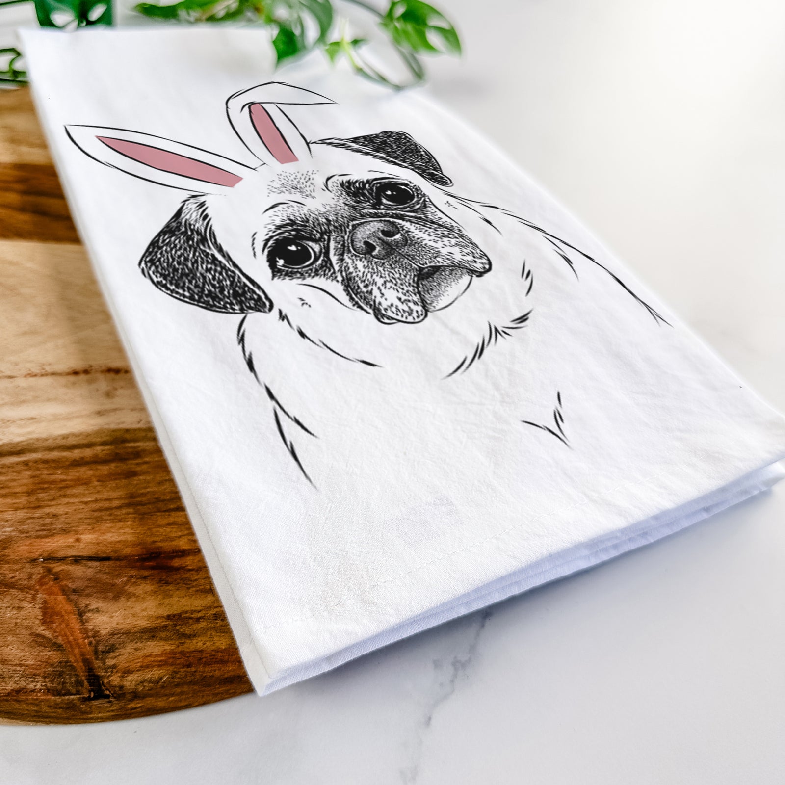 Hand-drawn sketch of Zoey the Pug wearing Easter bunny ears on a tea towel