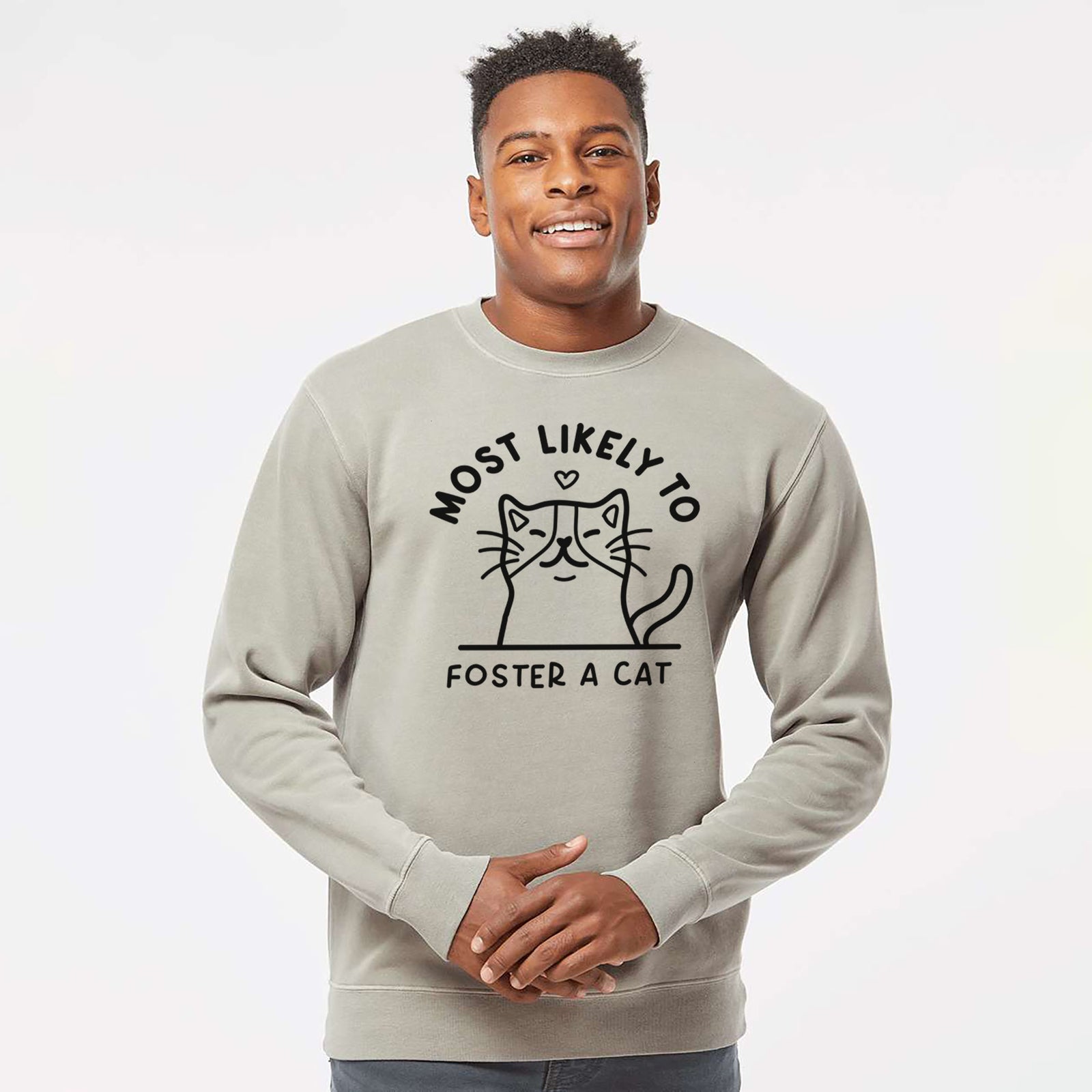 'Most Likely to Foster a Cat' design on a Cement Unisex pigment dyed crew sweatshirt