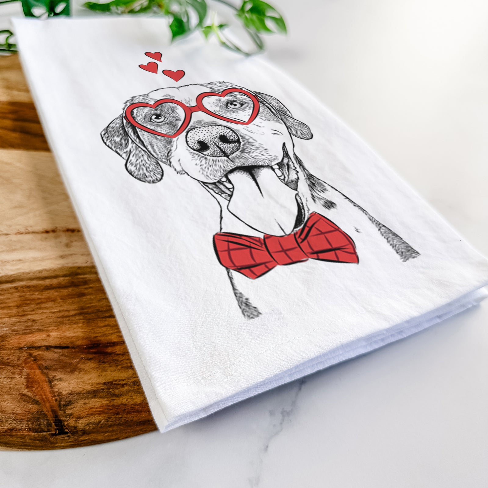 Hand-drawn sketch of Ace Boogie the Mixed Breed wearing heart-shaped glasses on a tea towel