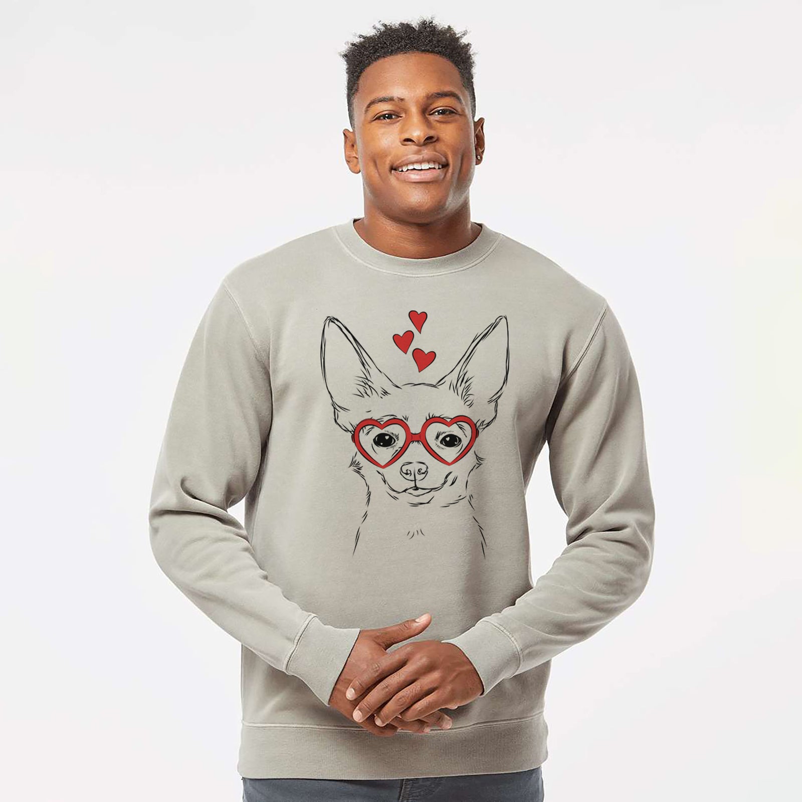 Hand-drawn sketch of Amos the Chihuahua wearing heart-shaped glasses on a Cement Unisex pigment dyed crew sweatshirt