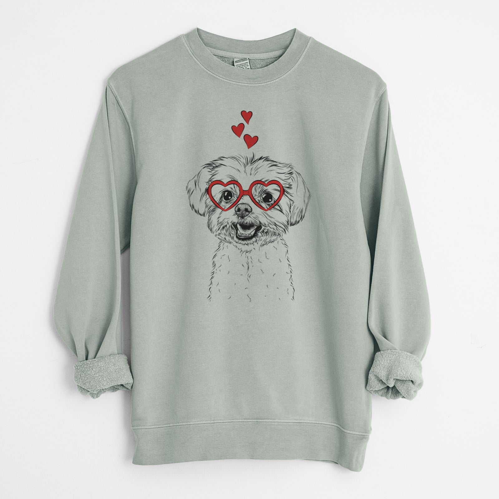 Hand-drawn sketch of Aspen the Morkie wearing heart-shaped glasses on a Sage Unisex pigment dyed crew sweatshirt