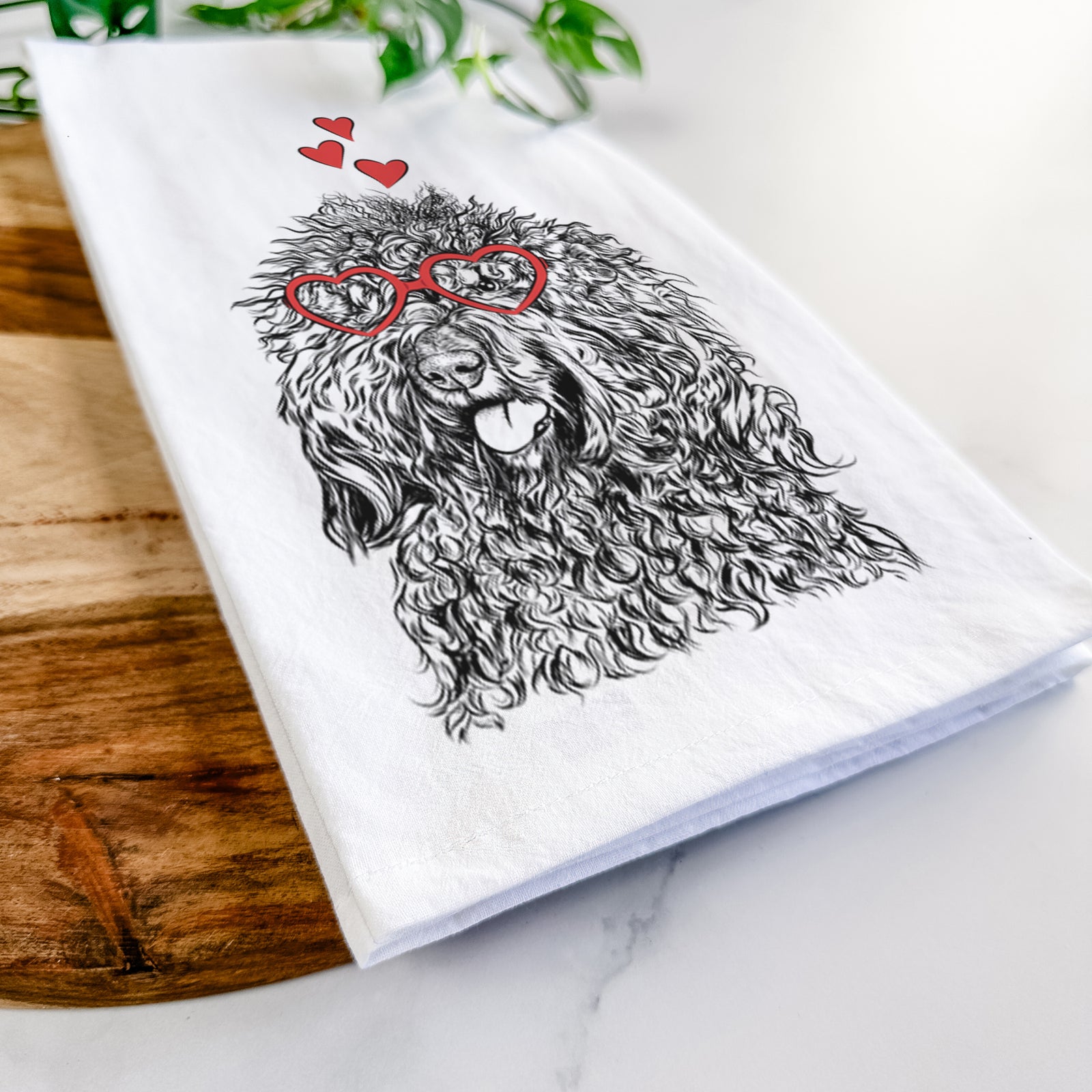 Hand-drawn sketch of Babs the Barbet wearing heart-shaped glasses on a tea towel