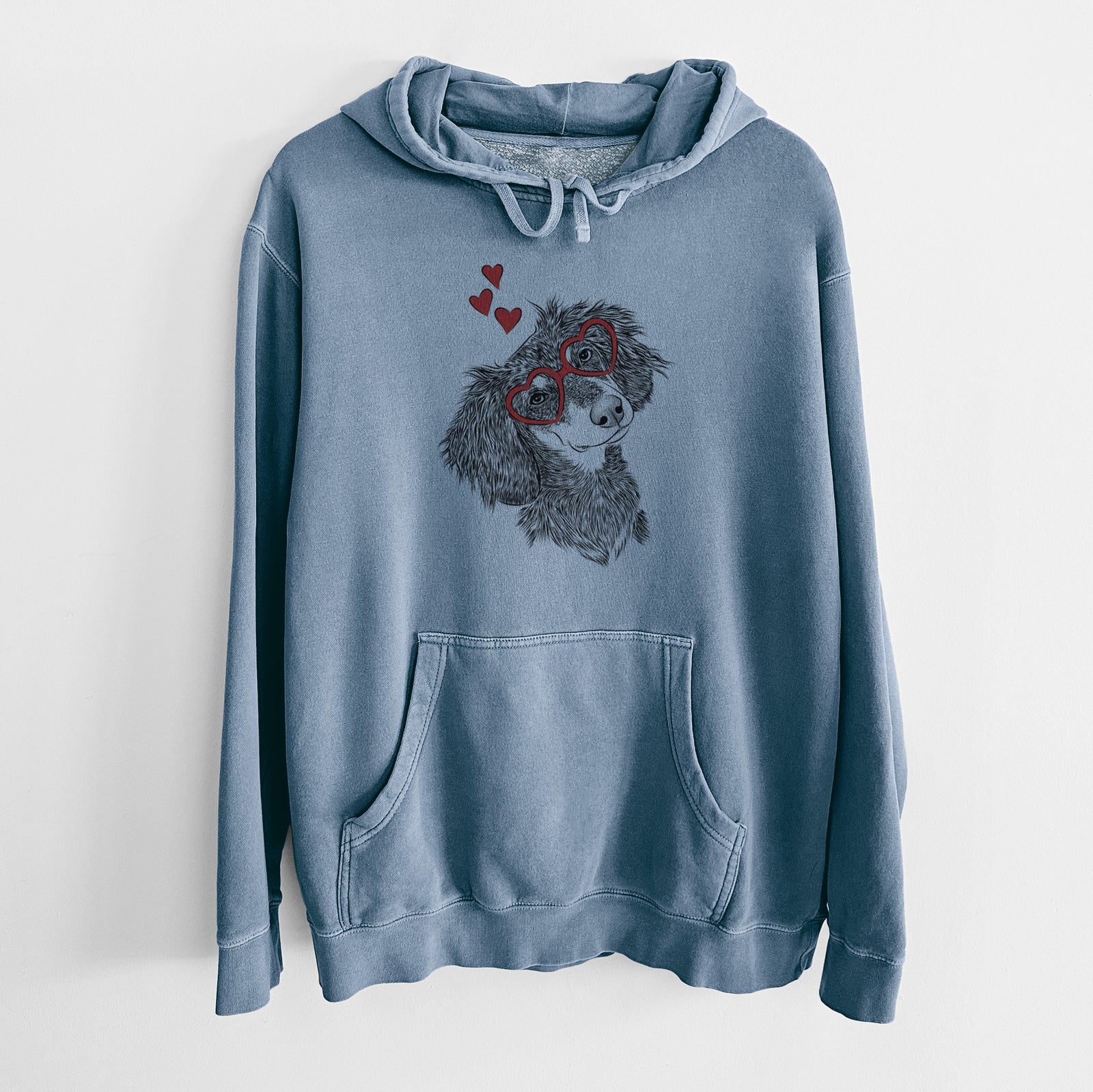 Hand-drawn sketch of Bailey the Long Haired Dachshund wearing heart-shaped glasses on a Slate Blue Unisex pigment dyed hoodie