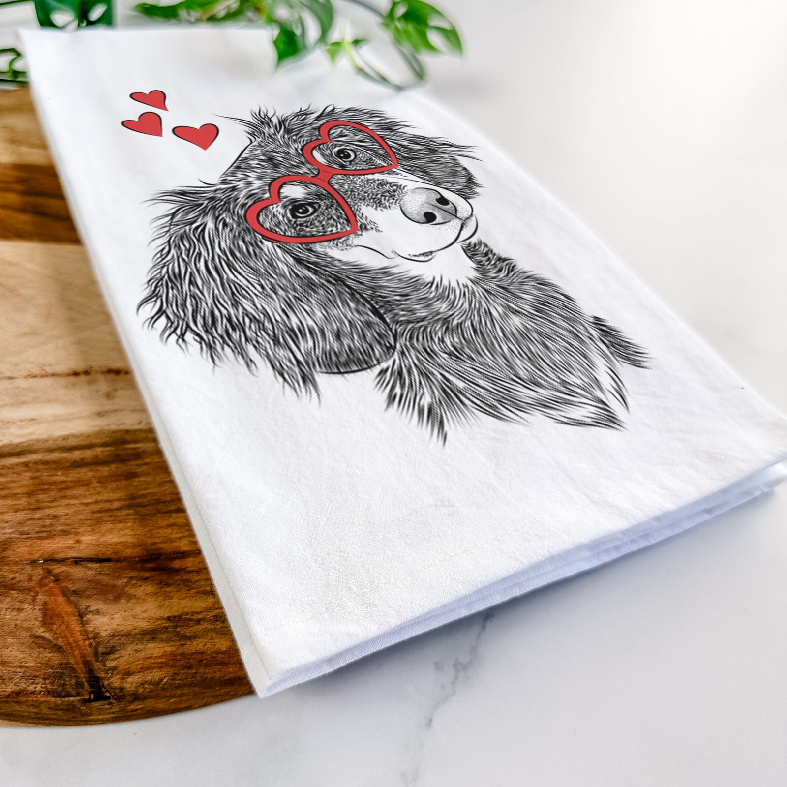 Hand-drawn sketch of Bailey the Long Haired Dachshund wearing heart-shaped glasses on a tea towel