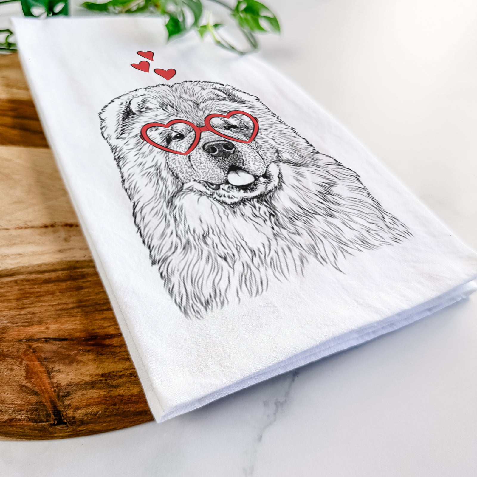 Hand-drawn sketch of Baloo the Chow Chow wearing heart-shaped glasses on a tea towel