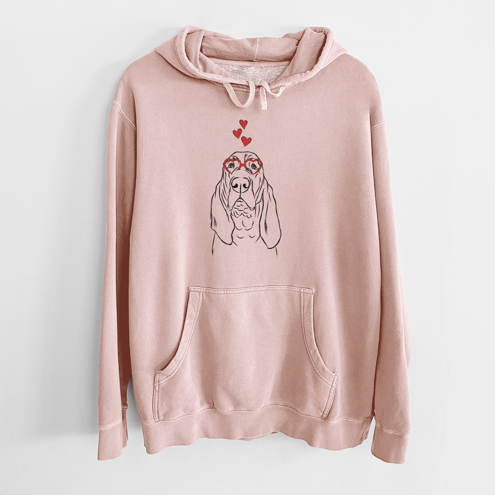 Hand-drawn sketch of Baron the Bloodhound wearing heart-shaped glasses on a Dusty Pink Unisex pigment dyed hoodie