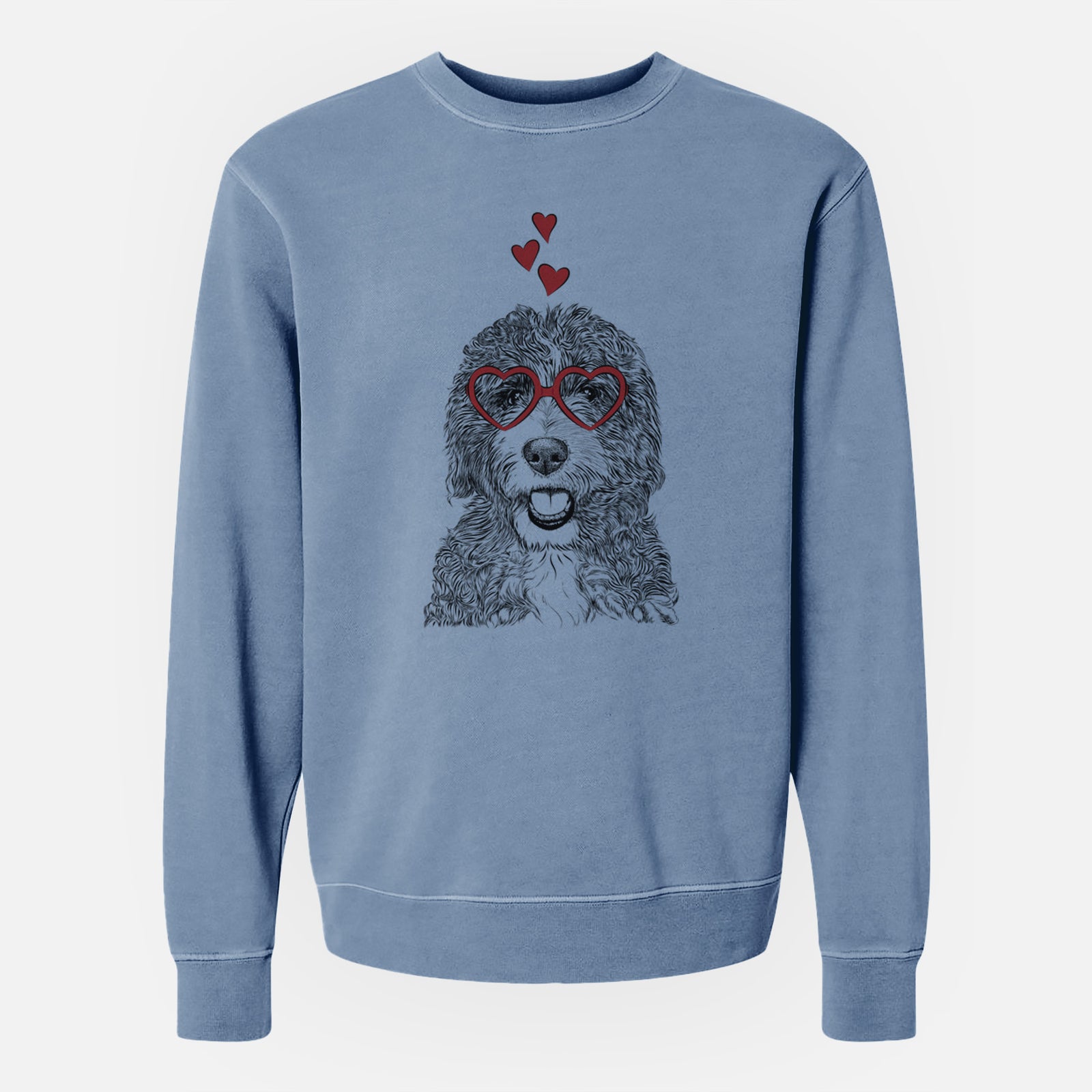 Hand-drawn sketch of Bash the Bernedoodle wearing heart-shaped glasses on a Slate Blue Unisex pigment dyed crew sweatshirt