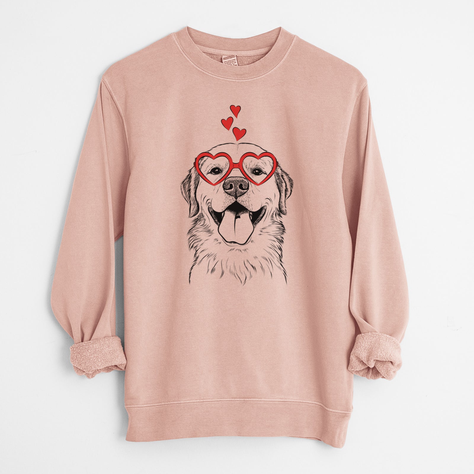 Hand-drawn sketch of Bennett the Golden Retriever wearing heart-shaped glasses on a Dusty Pink Unisex pigment dyed crew sweatshirt