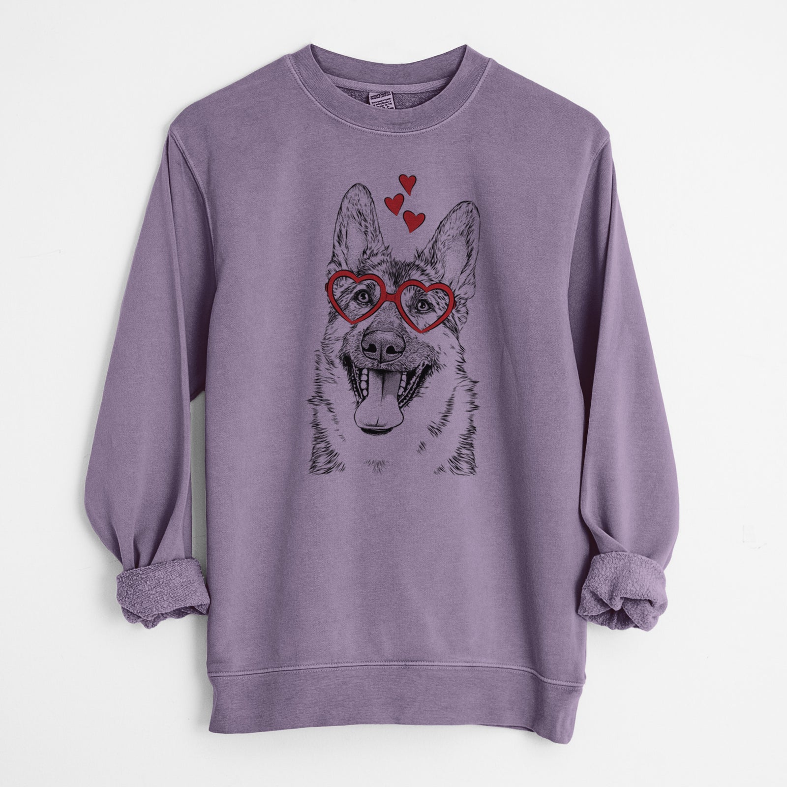 Hand-drawn sketch of Benson the German Shepherd wearing heart-shaped glasses on a Plum Unisex pigment dyed crew sweatshirt