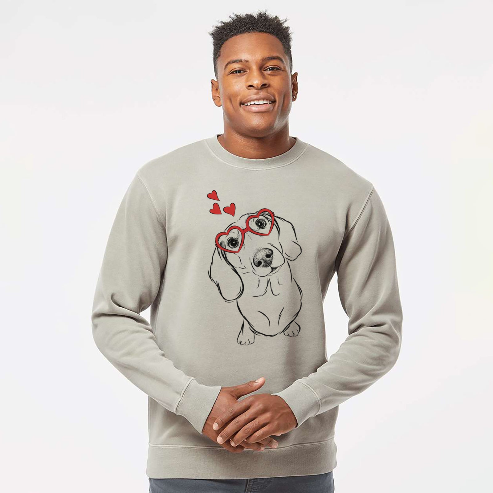 Hand-drawn sketch of Bill the Dachshund wearing heart-shaped glasses on a Cement Unisex pigment dyed crew sweatshirt