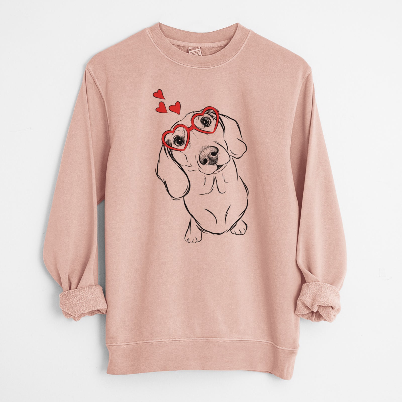 Hand-drawn sketch of Bill the Dachshund wearing heart-shaped glasses on a Dusty Pink Unisex pigment dyed crew sweatshirt