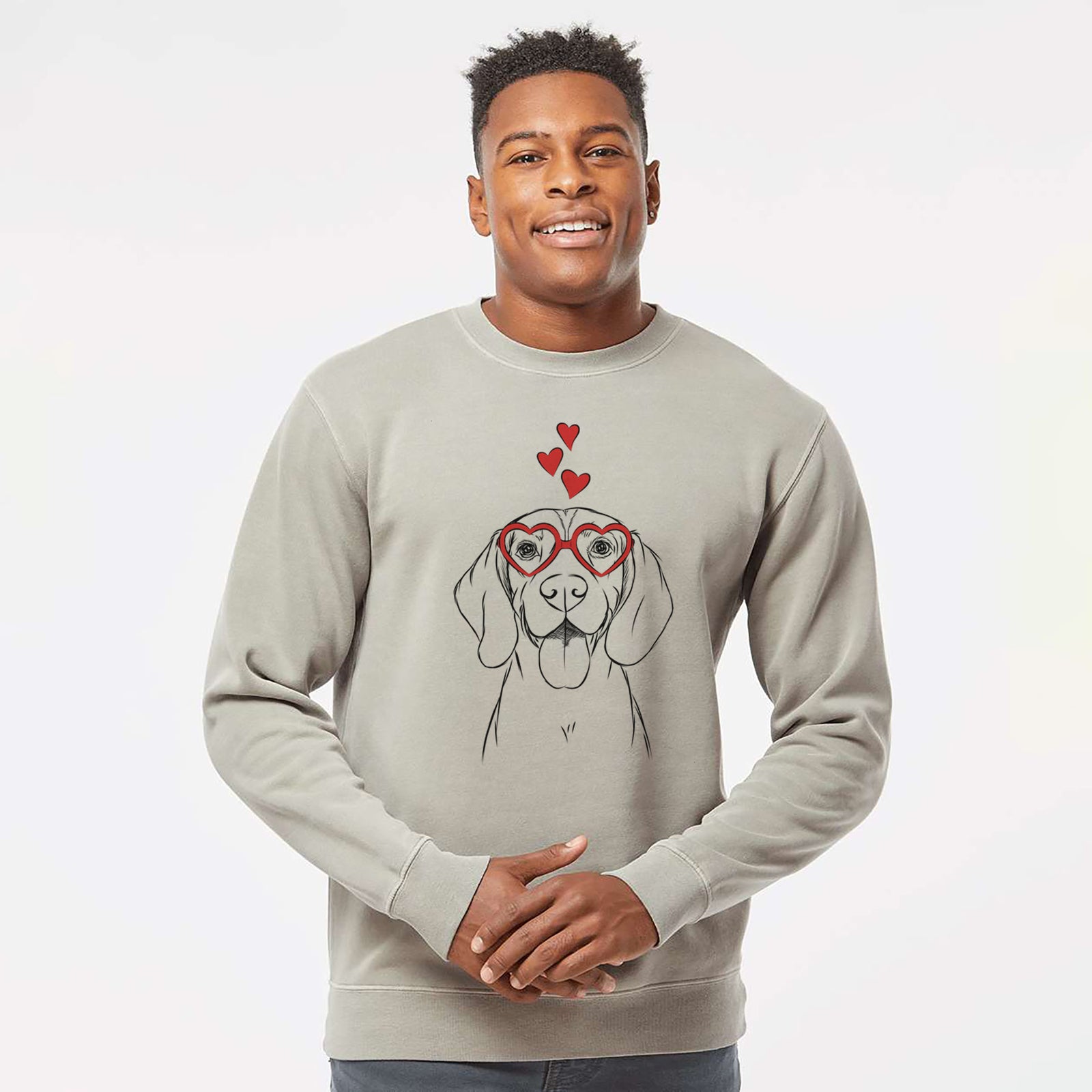 Hand-drawn sketch of Bogie the Beagle wearing heart-shaped glasses on a Cement Unisex pigment dyed crew sweatshirt