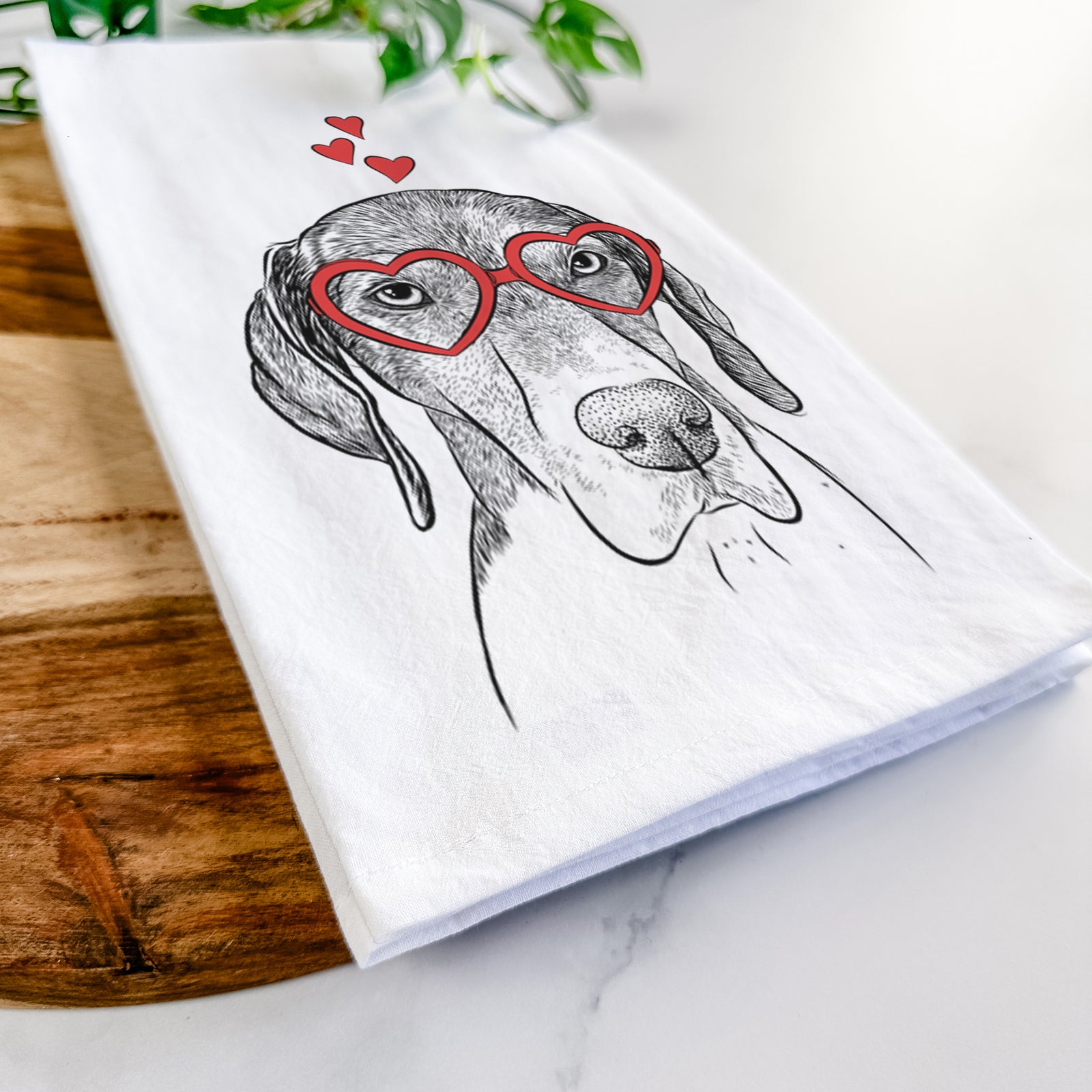 Hand-drawn sketch of Bohdi the German Shorthaired Pointer wearing heart-shaped glasses on a tea towel