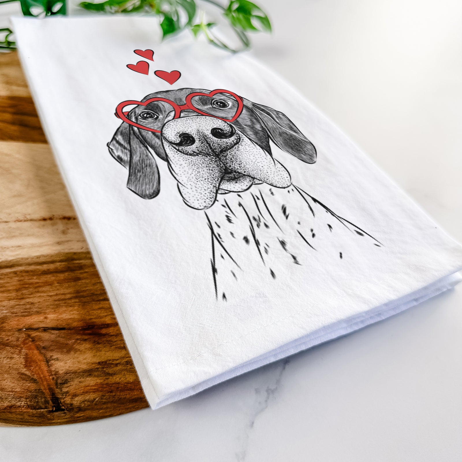 Hand-drawn sketch of Booze the German Shorthaired Pointer wearing heart-shaped glasses on a tea towel