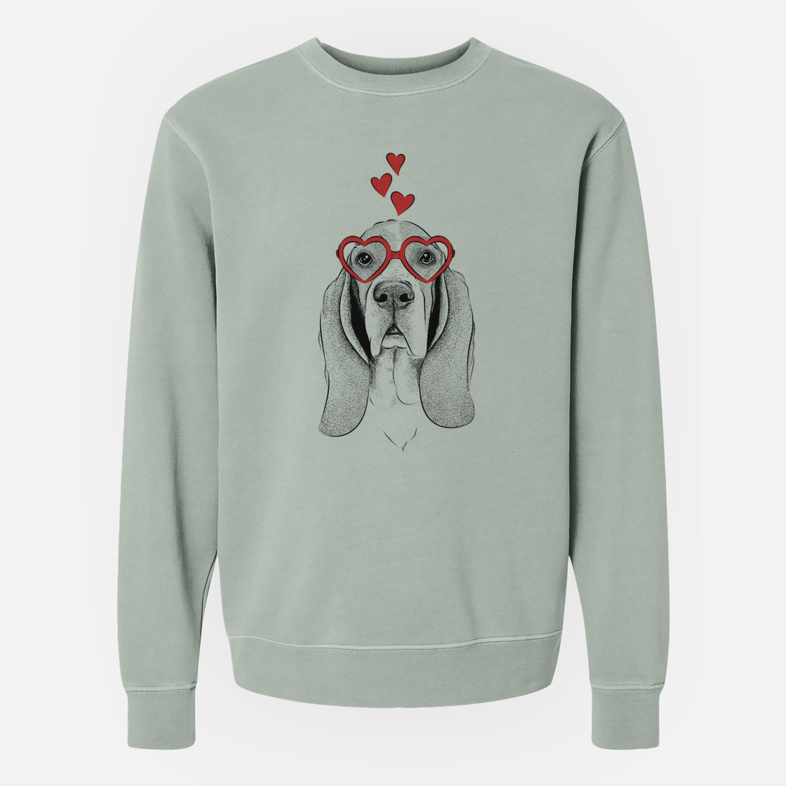 Hand-drawn sketch of Buckley the Basset Hound wearing heart-shaped glasses on a Sage Unisex pigment dyed crew sweatshirt