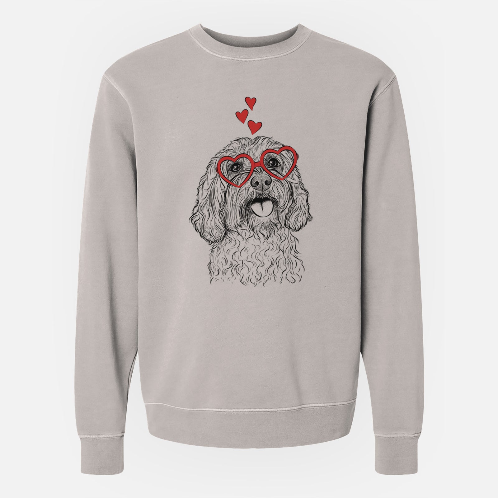Hand-drawn sketch of Cali the Cavapoo wearing heart-shaped glasses on a Cement Unisex pigment dyed crew sweatshirt