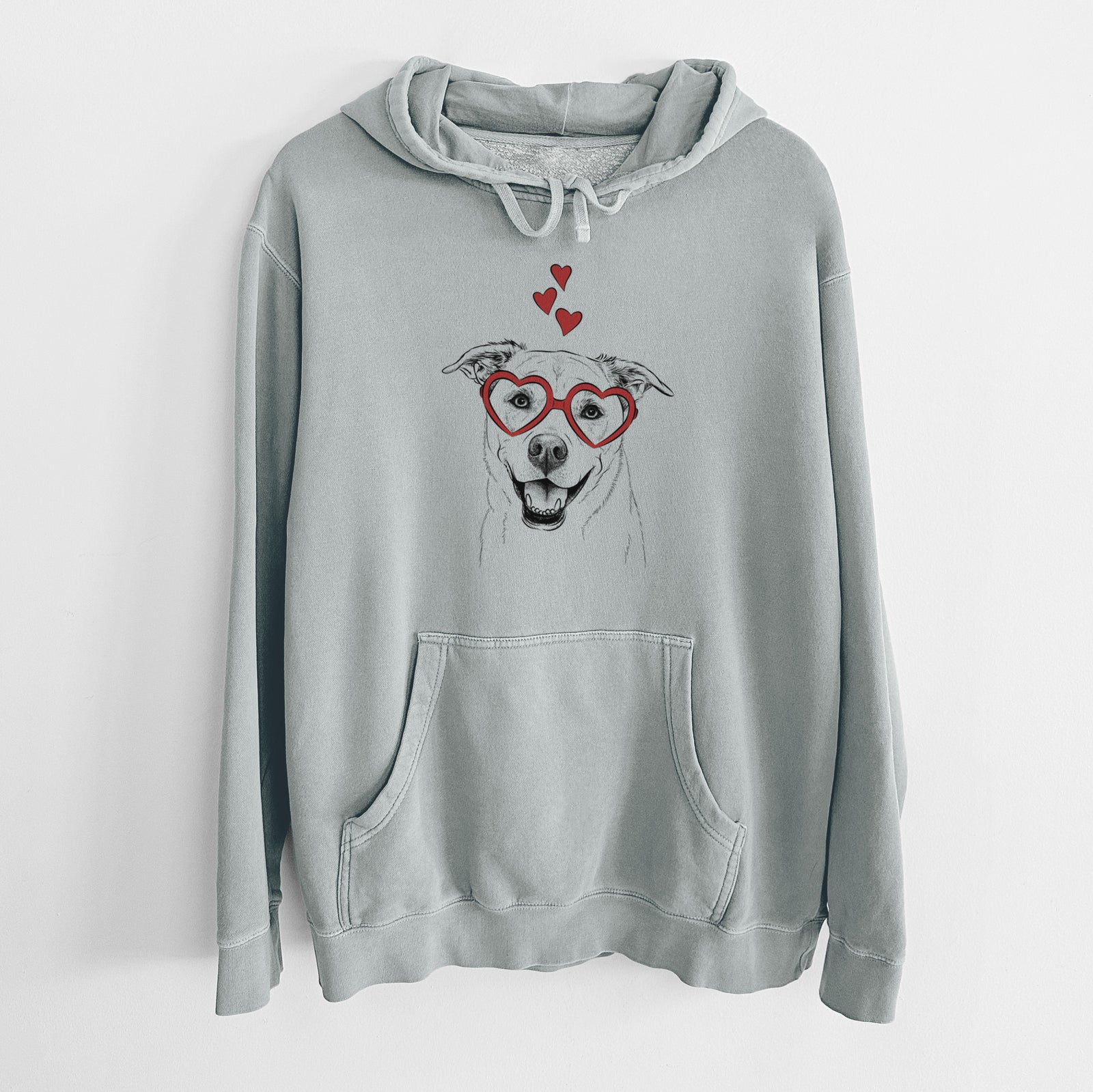 Hand-drawn sketch of Carl the Mixed Breed wearing heart-shaped glasses on a Sage Unisex pigment dyed hoodie