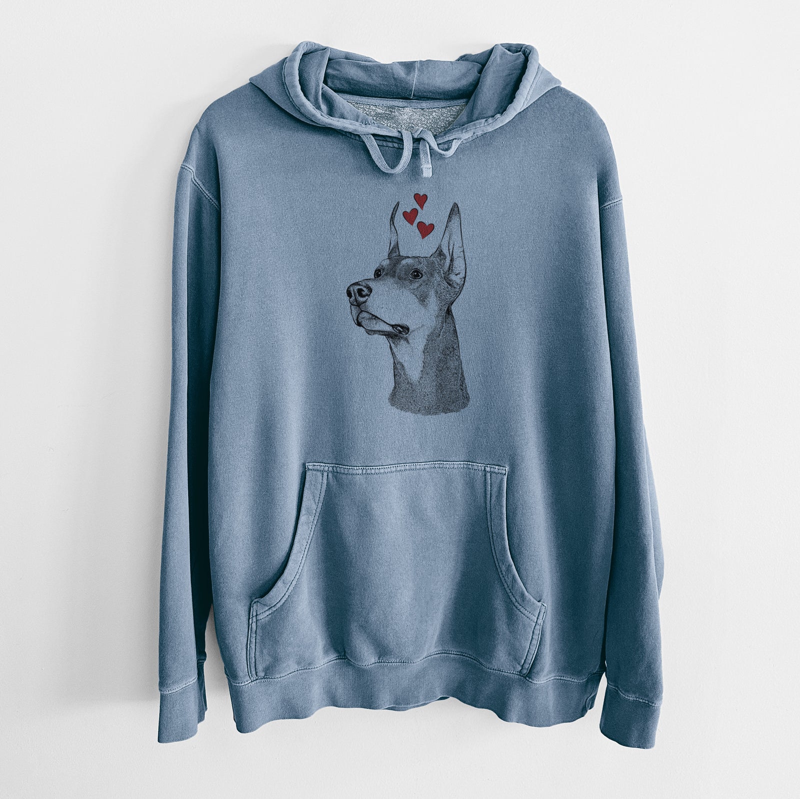 Hand-drawn sketch of Cenza the Doberman Pinscher wearing heart-shaped glasses on a Slate Blue Unisex pigment dyed hoodie