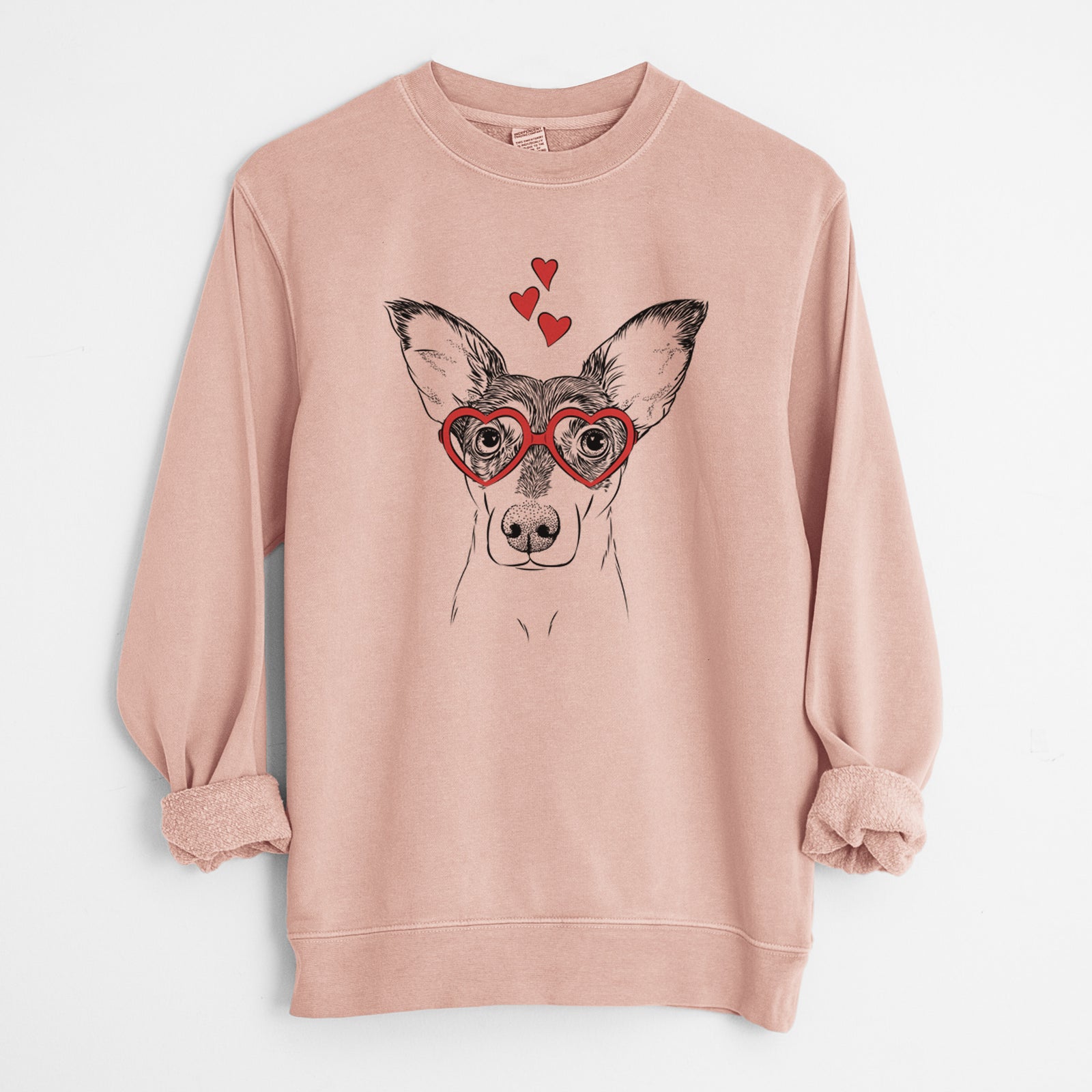 Hand-drawn sketch of Chloe the Doxie Mix wearing heart-shaped glasses on a Dusty Pink Unisex pigment dyed crew sweatshirt