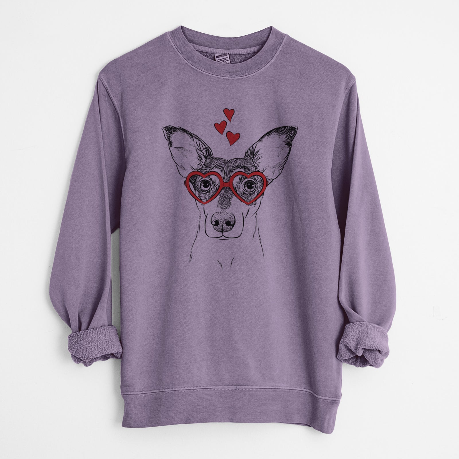 Hand-drawn sketch of Chloe the Doxie Mix wearing heart-shaped glasses on a Plum Unisex pigment dyed crew sweatshirt