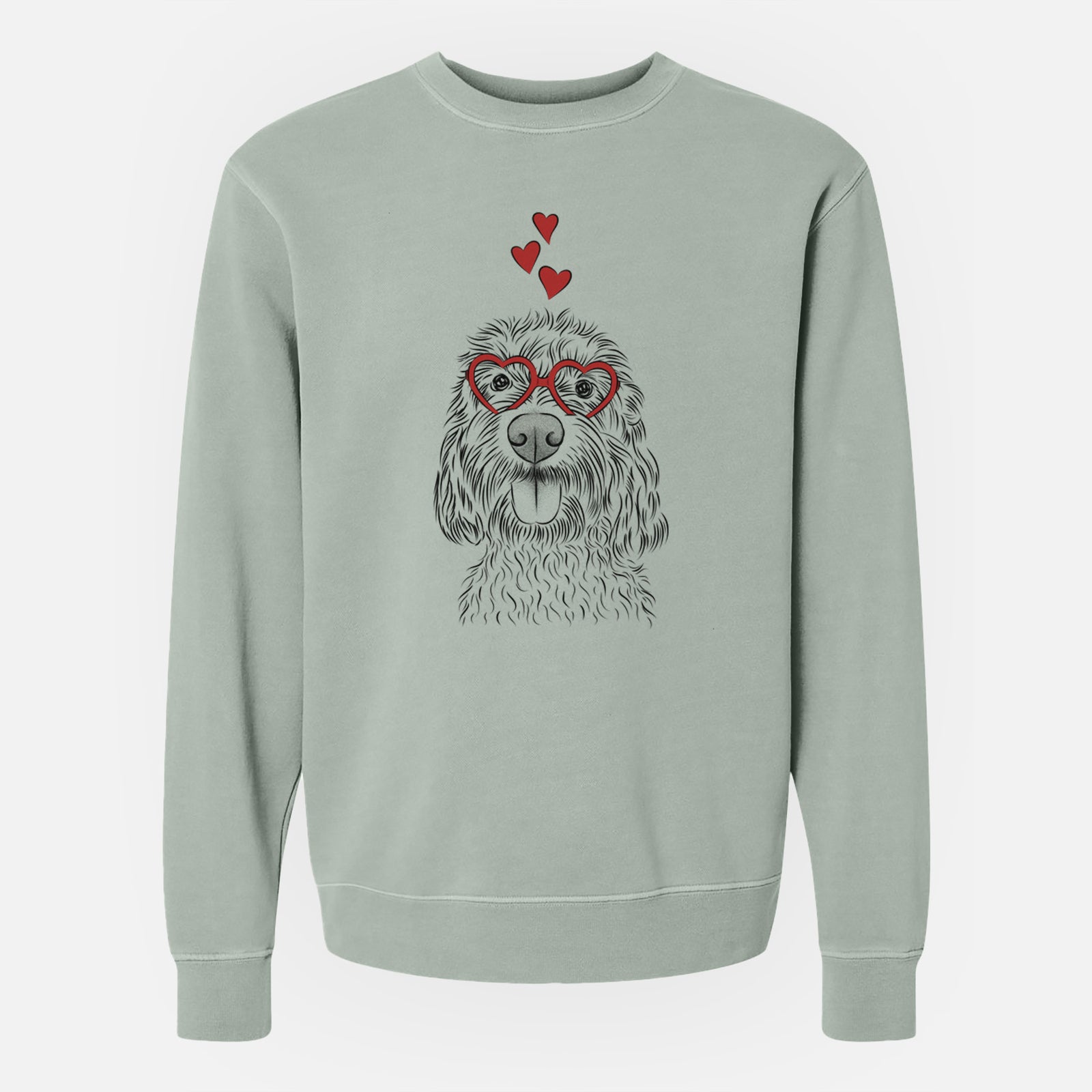 Hand-drawn sketch of Clover the Cockapoo wearing heart-shaped glasses on a Sage Unisex pigment dyed crew sweatshirt