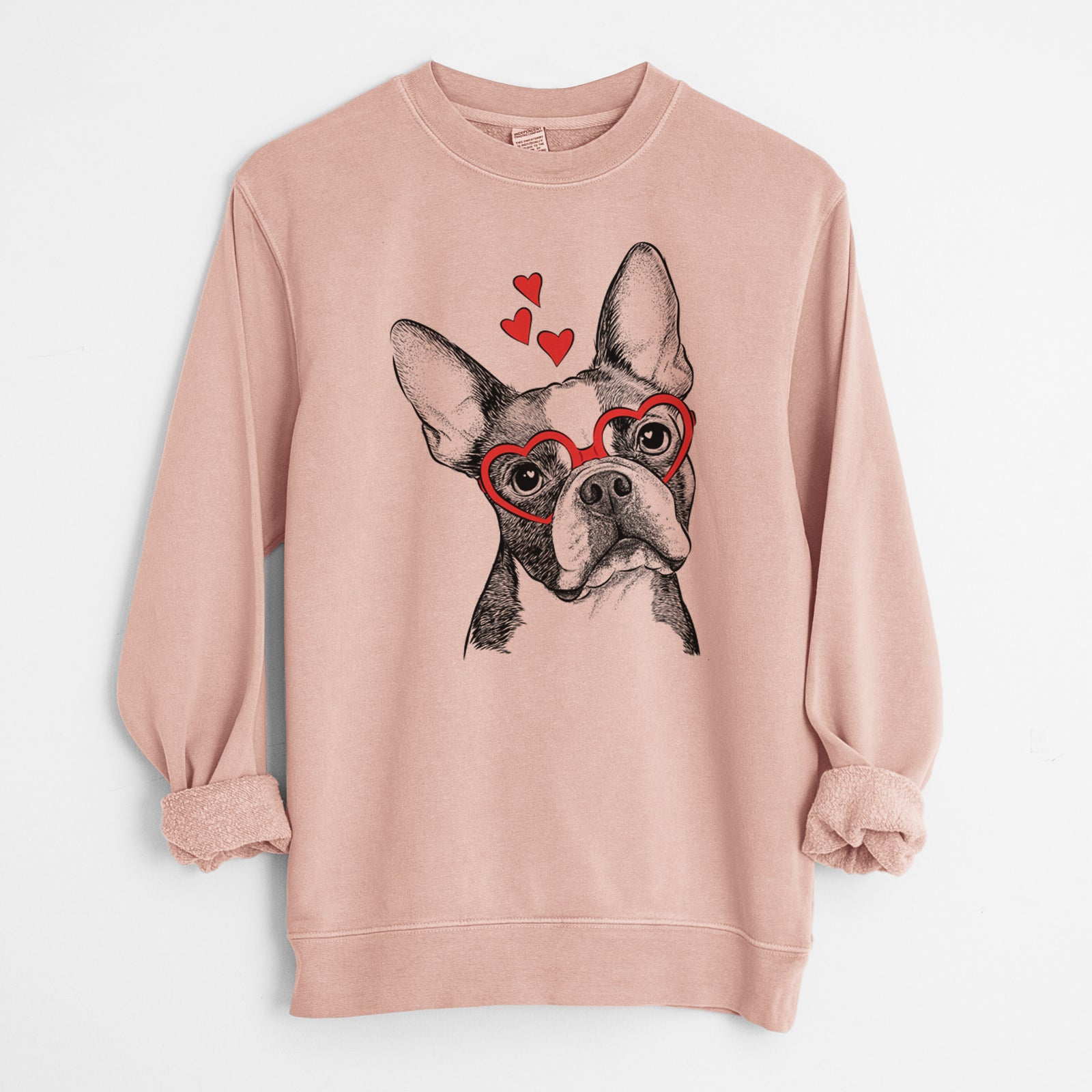 Hand-drawn sketch of Dee Dee the Boston Terrier wearing heart-shaped glasses on a Dusty Pink Unisex pigment dyed crew sweatshirt