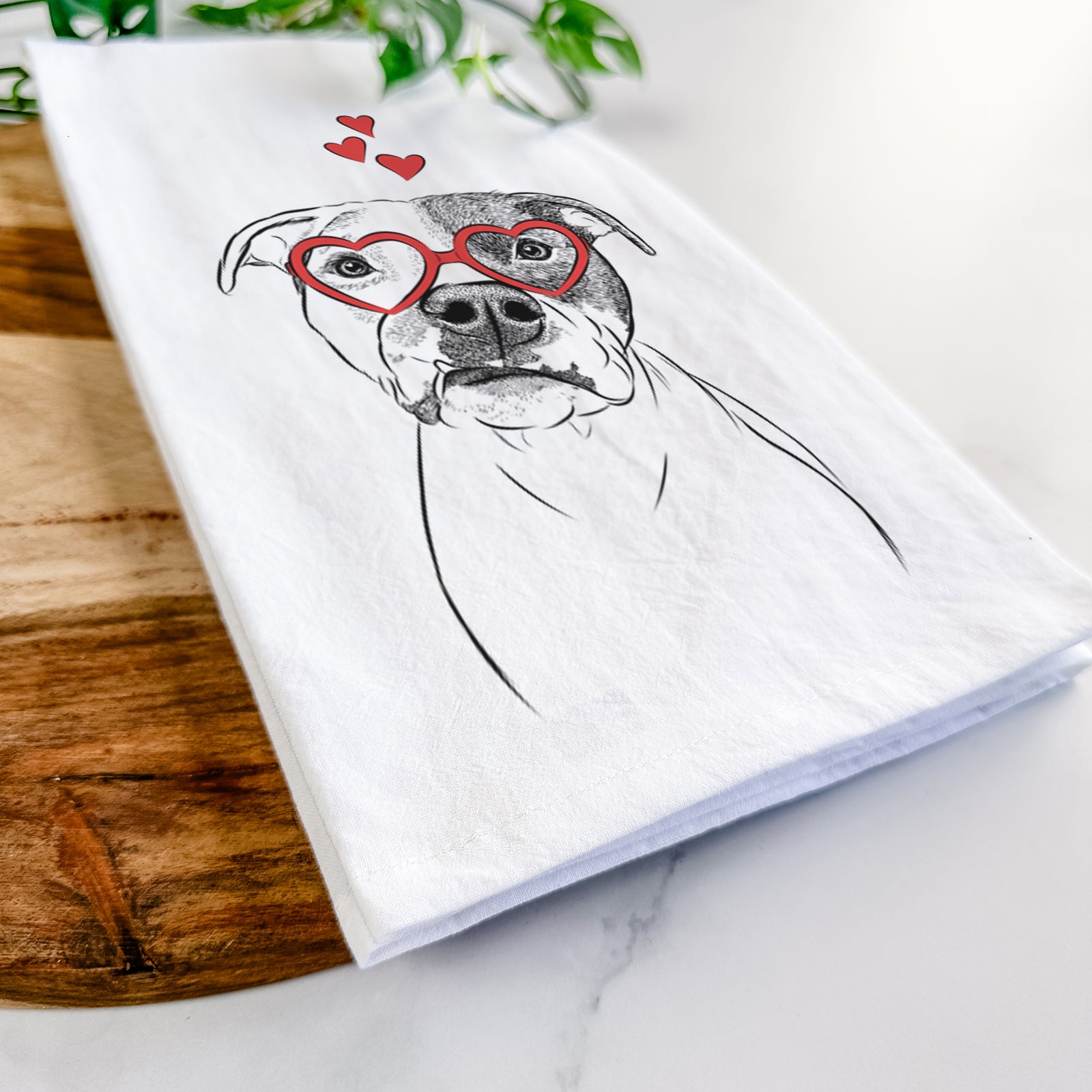 Hand-drawn sketch of Dexter the Pitbull wearing heart-shaped glasses on a tea towel