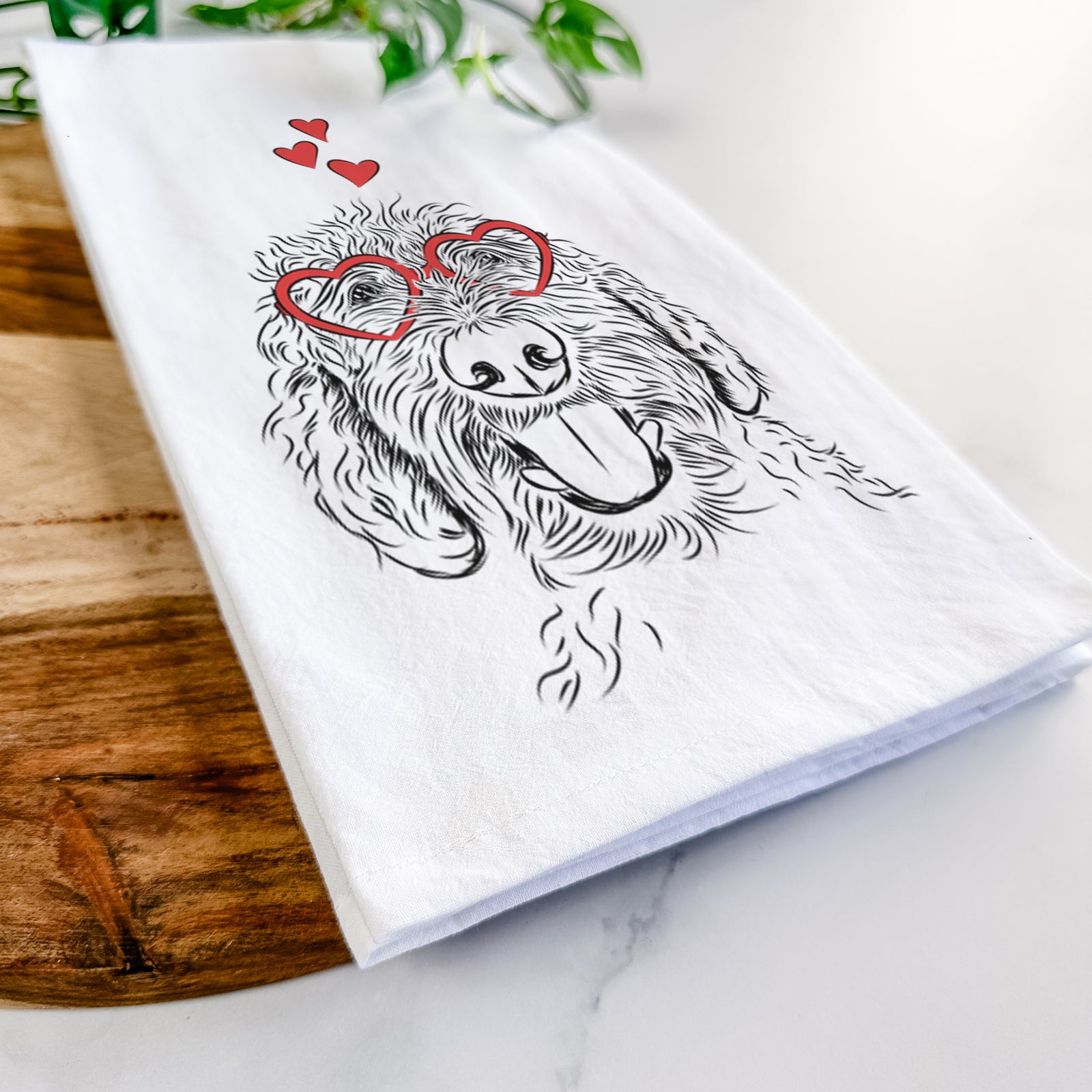 Hand-drawn sketch of Dixie the Doodle wearing heart-shaped glasses on a tea towel